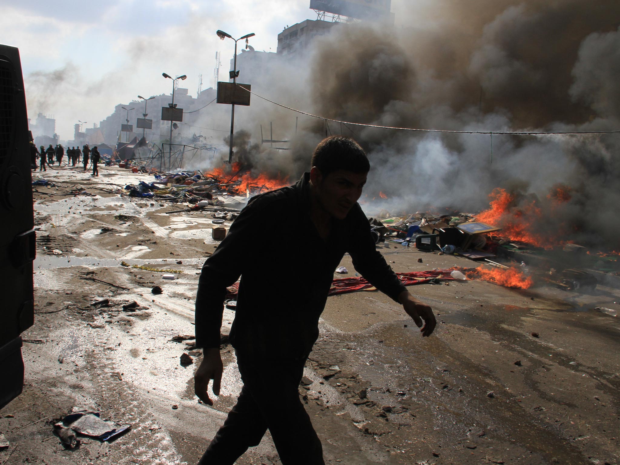 Egyptian security forces clear a sit-in by supporters of ousted Islamist President Mohammed Morsi