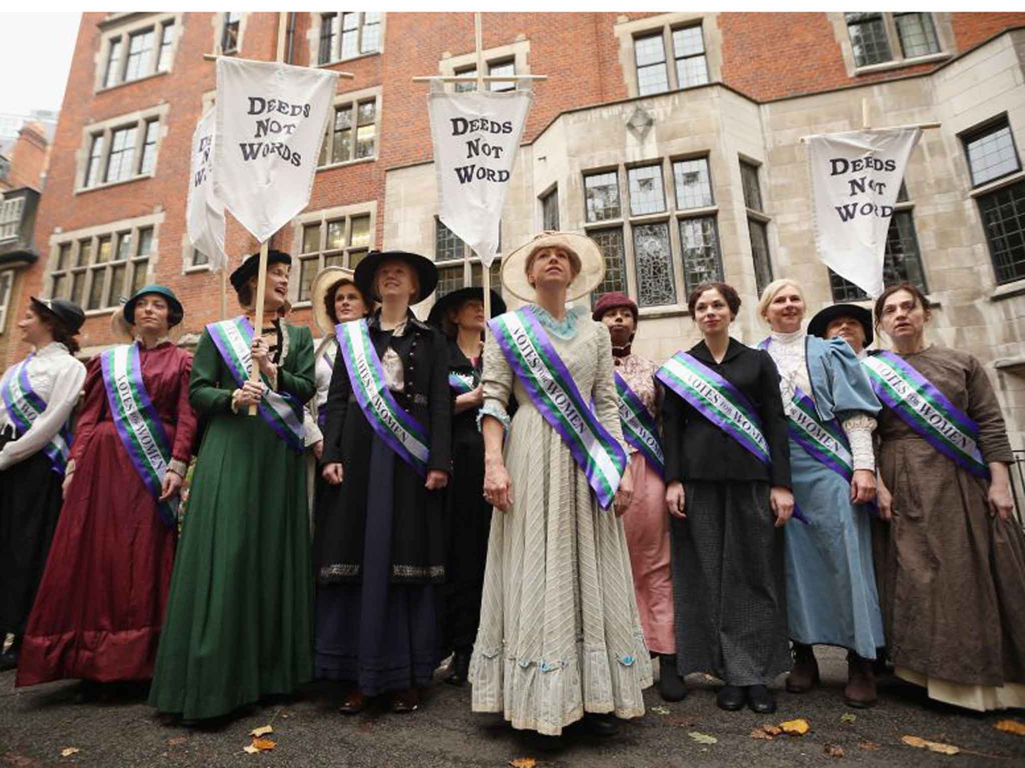 Hear their roar: campaigners dressed as suffragettes attend a rally organised by UK Feminista