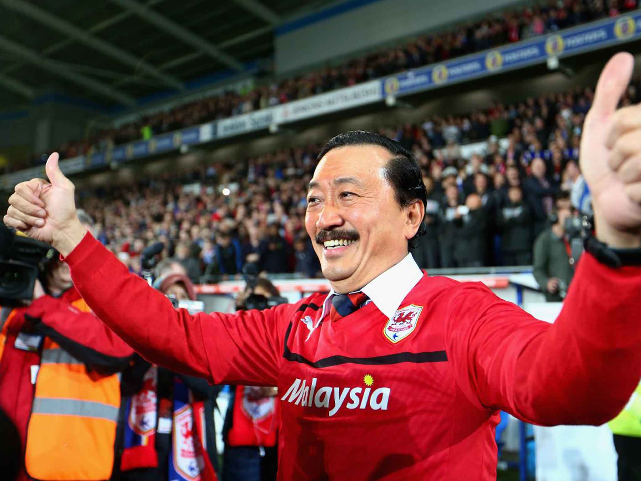 Cardiff City owner Vincent Tan celebrates his team’s promotion to the Premier League