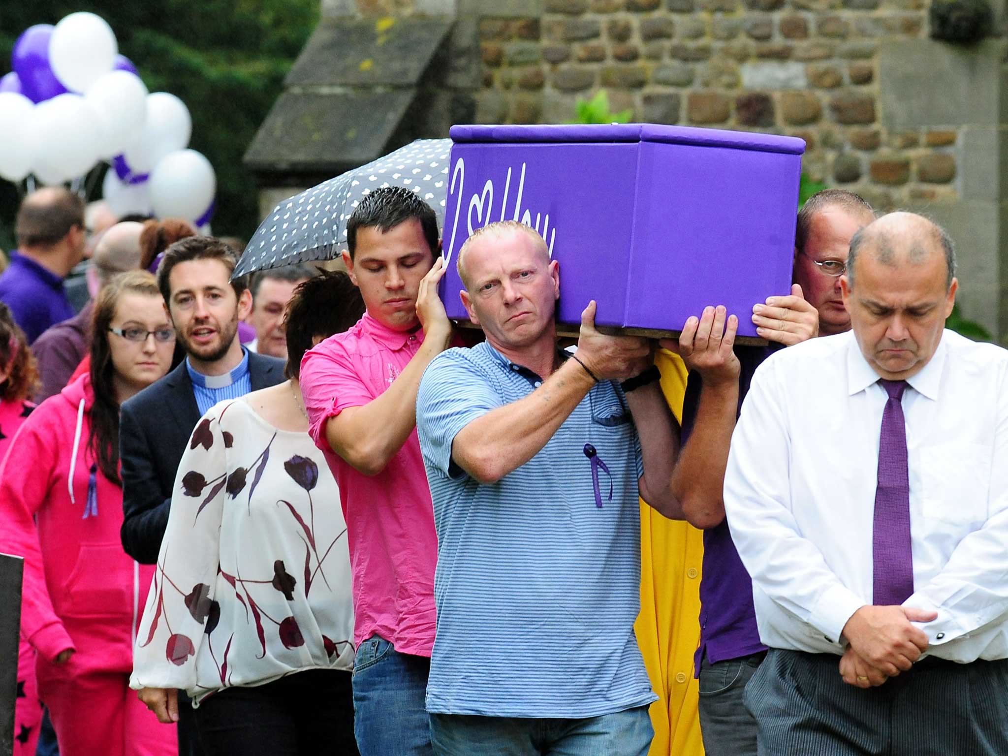 Hannah Smith's father David Smith (centre) carries her coffin following the teenager's funeral service