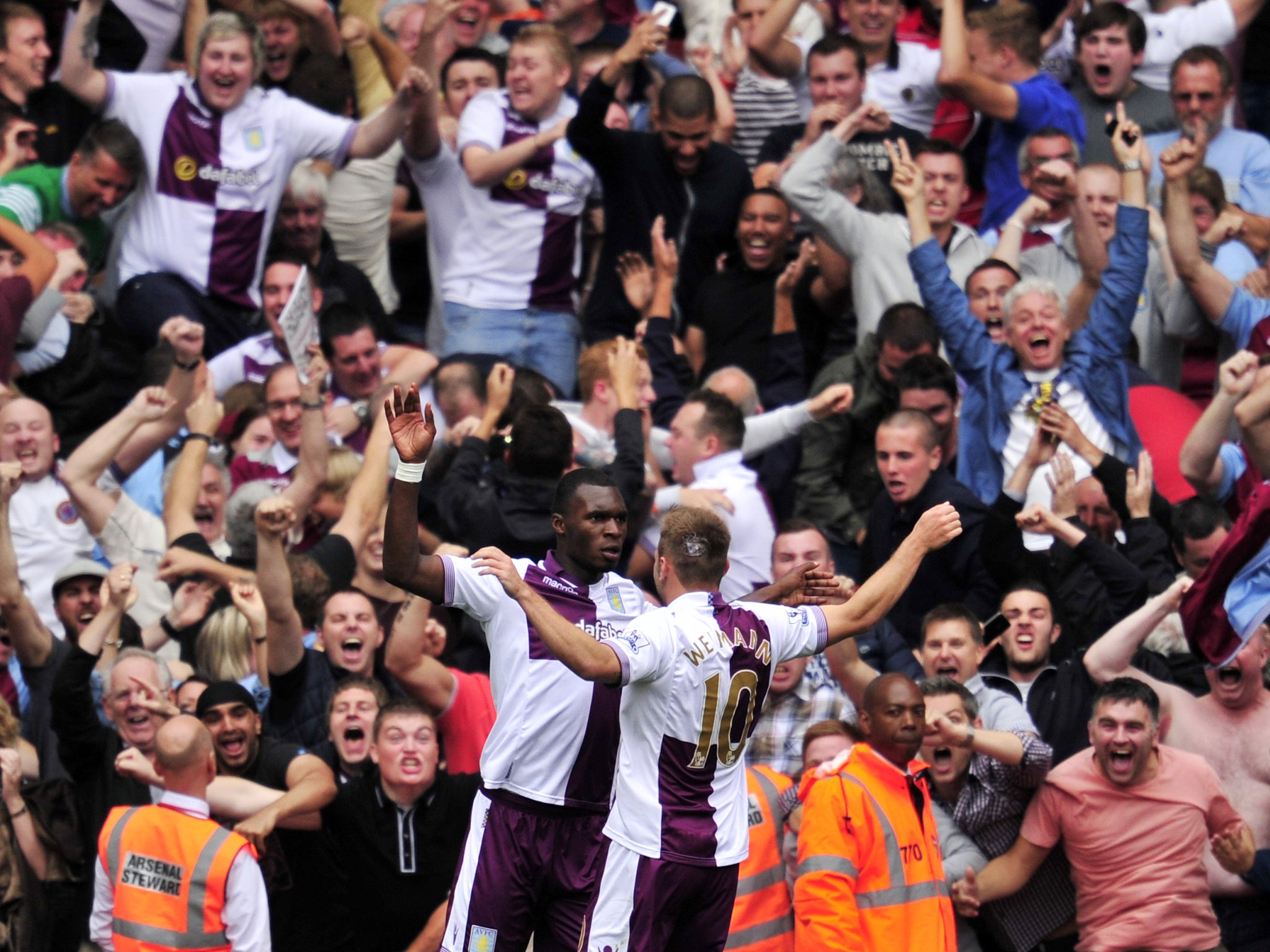 Christian Benteke celebrates scoring a penalty against Arsenal