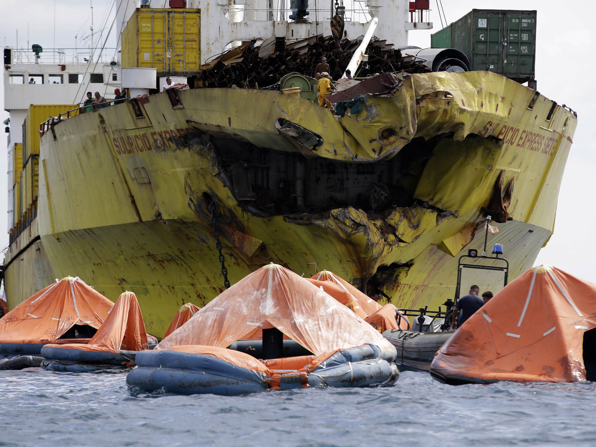 Life rafts in front of the holed cargo ship