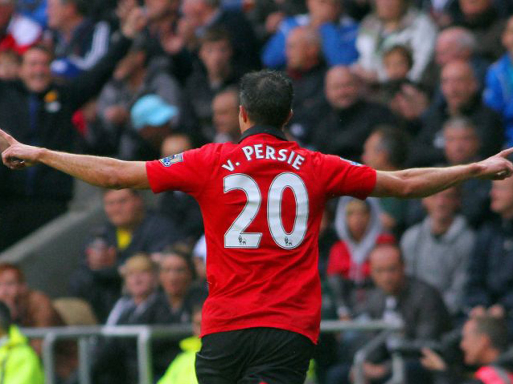 Robin van Persie celebrates his second goal, the brace following a similar haul in the Community Shield last week (Geoff Caddick/EPA)