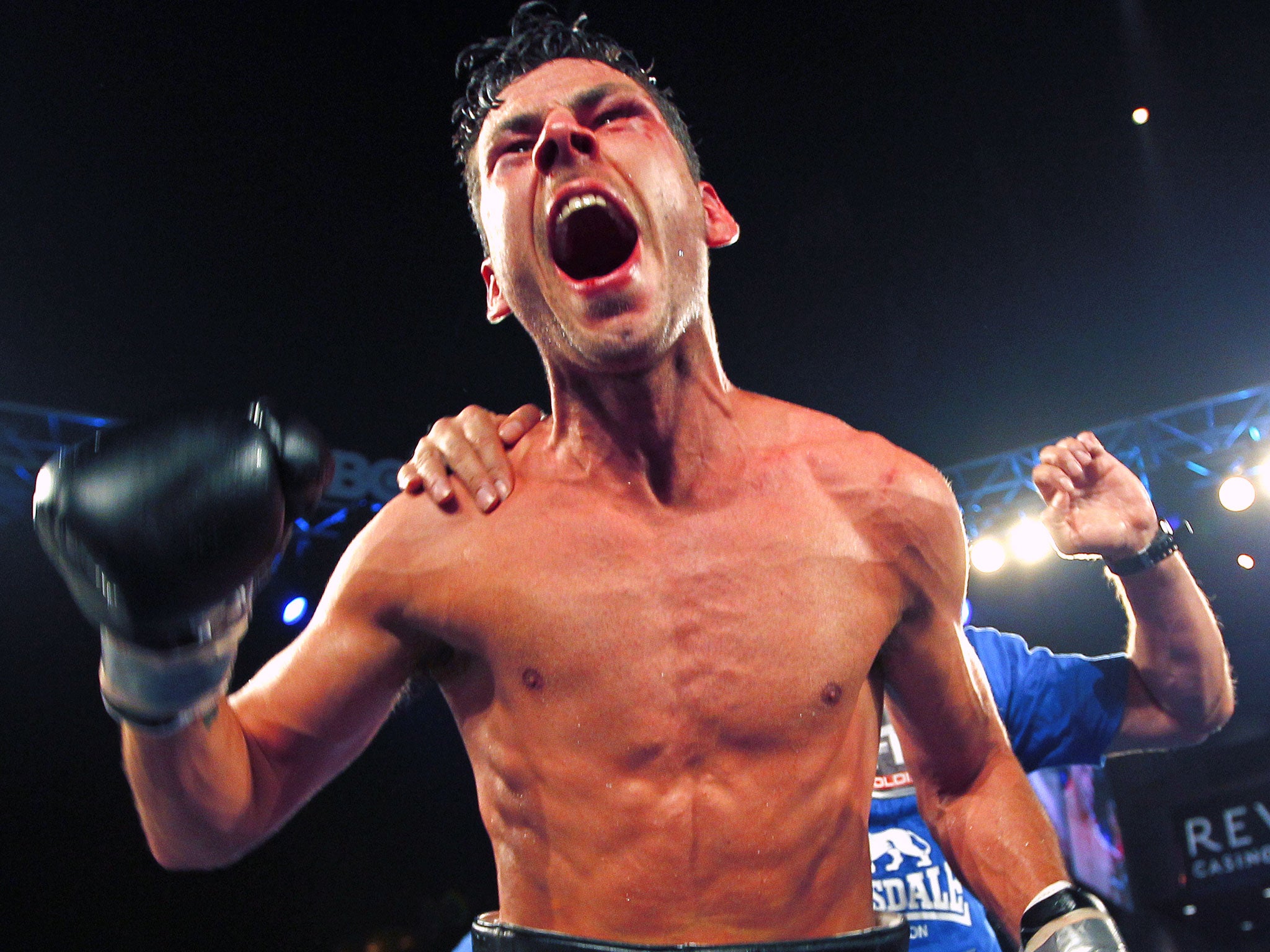 Darren Barker celebrates becoming world champion after split decision victory over the Australian Daniel Geale