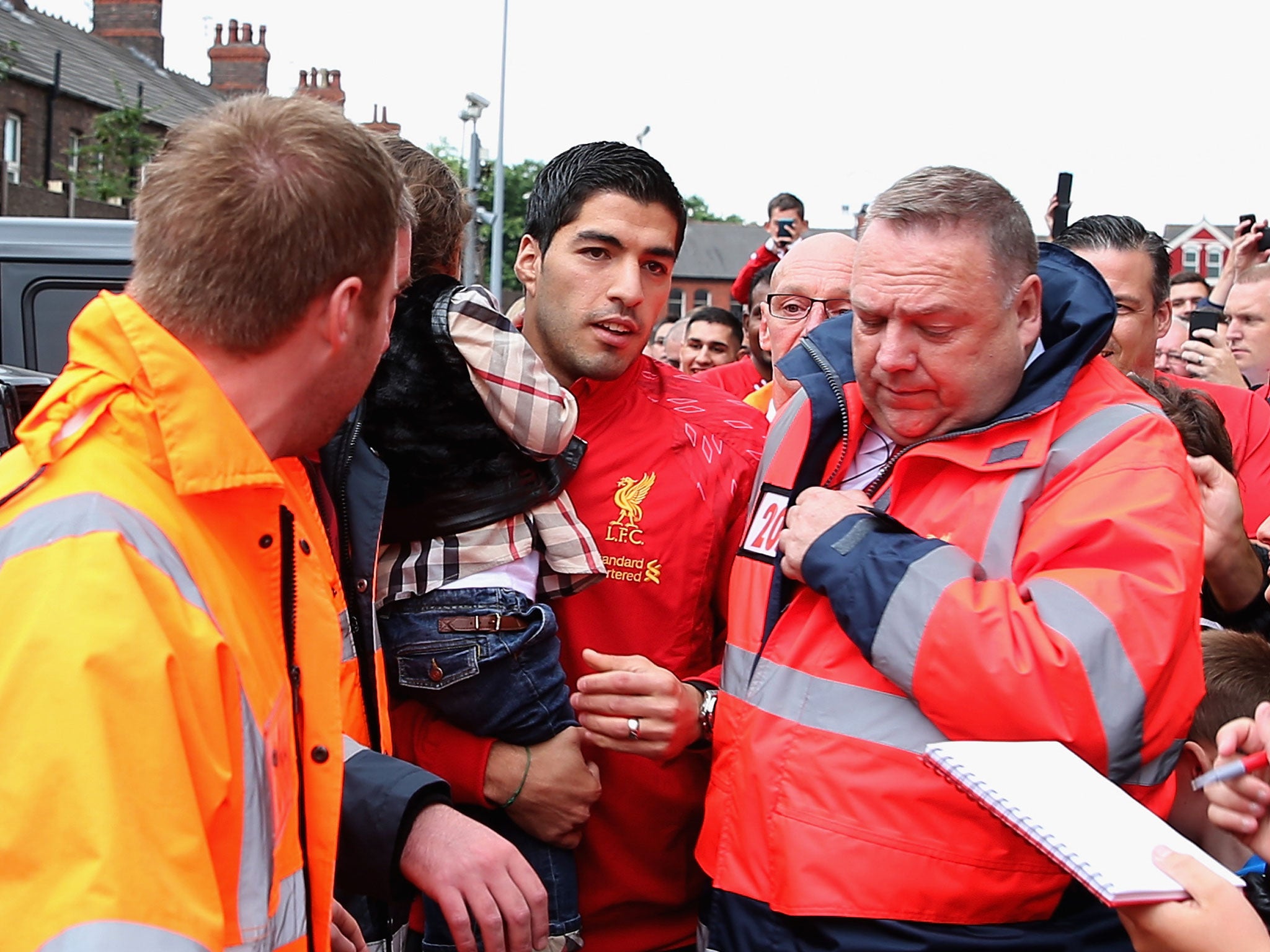 Luis Suarez arrives at Anfield yesterday to watch Liverpool's 1-10 victory over Stoke