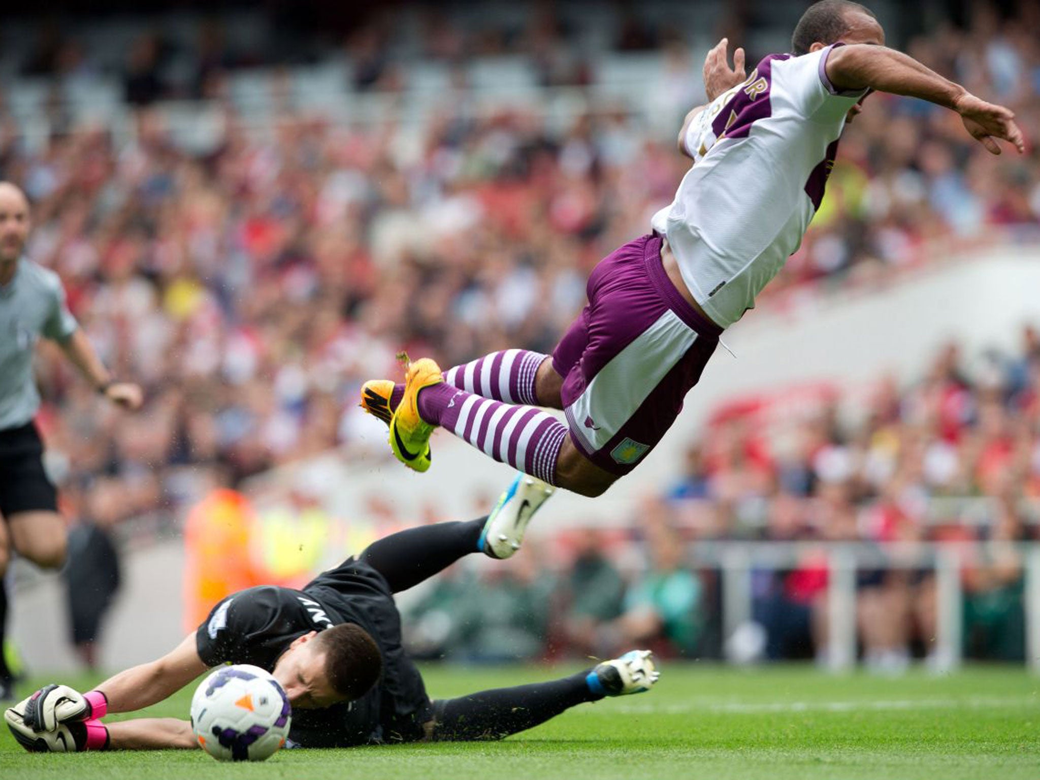 Wojciech Szczesny fouls Gabriel Agbonlahor to give away a penalty