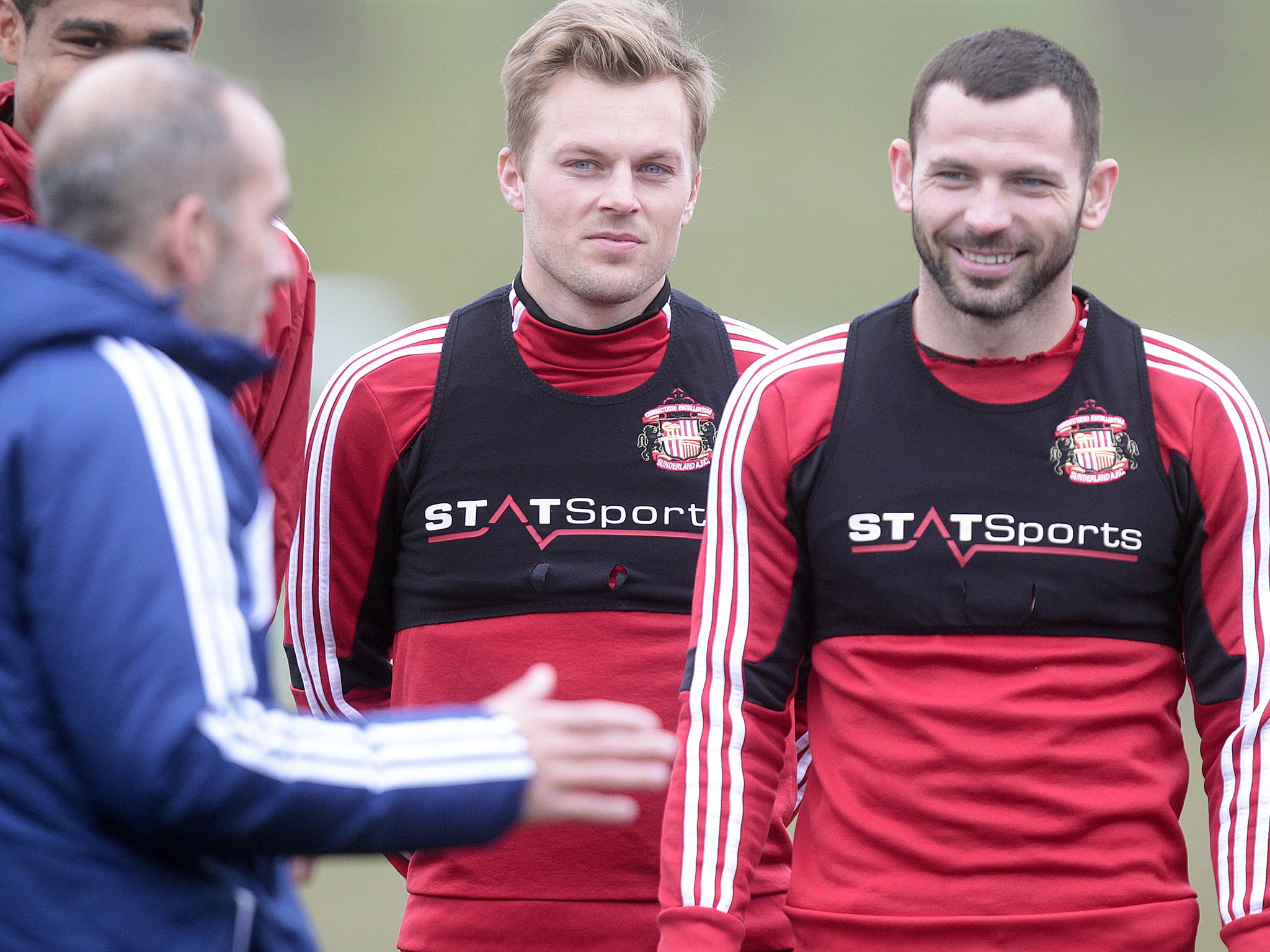 Phil Bardsley alongside Sebastian Larsson as they listen to Sunderland boss Paolo Di Canio