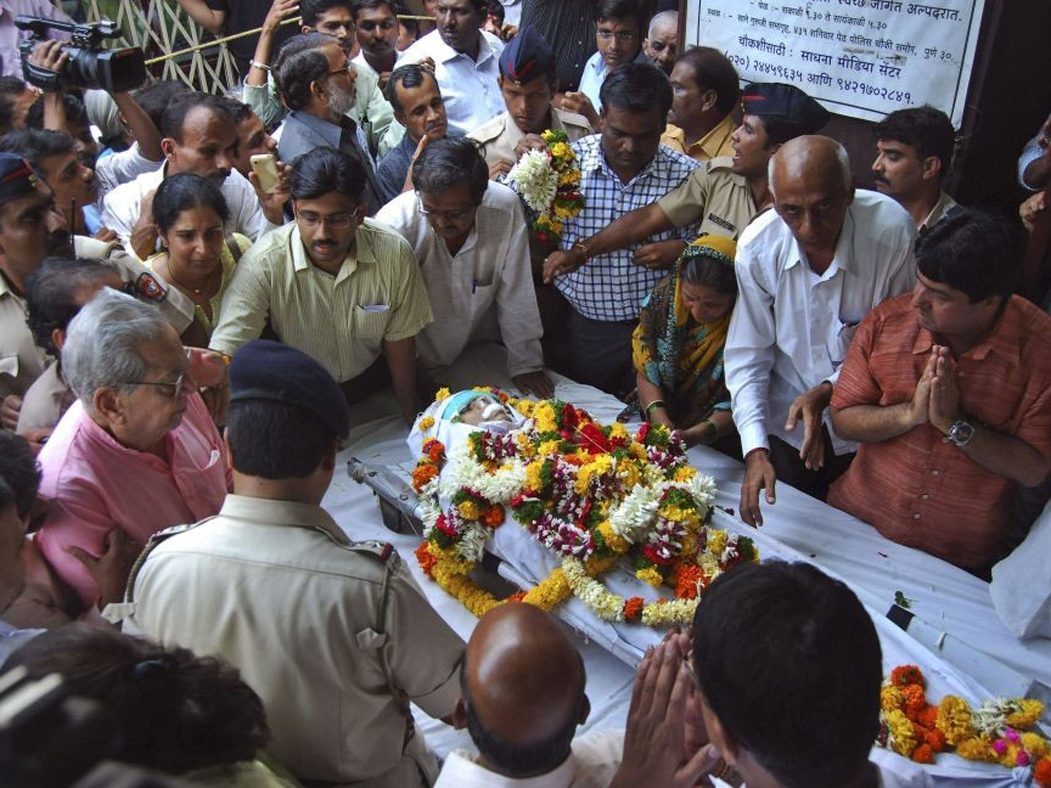 Narendra Dabholkar received threats for his work against mysticism and spirituality. Mourners pay last respects to the anti-superstition activist who was killed in Pune