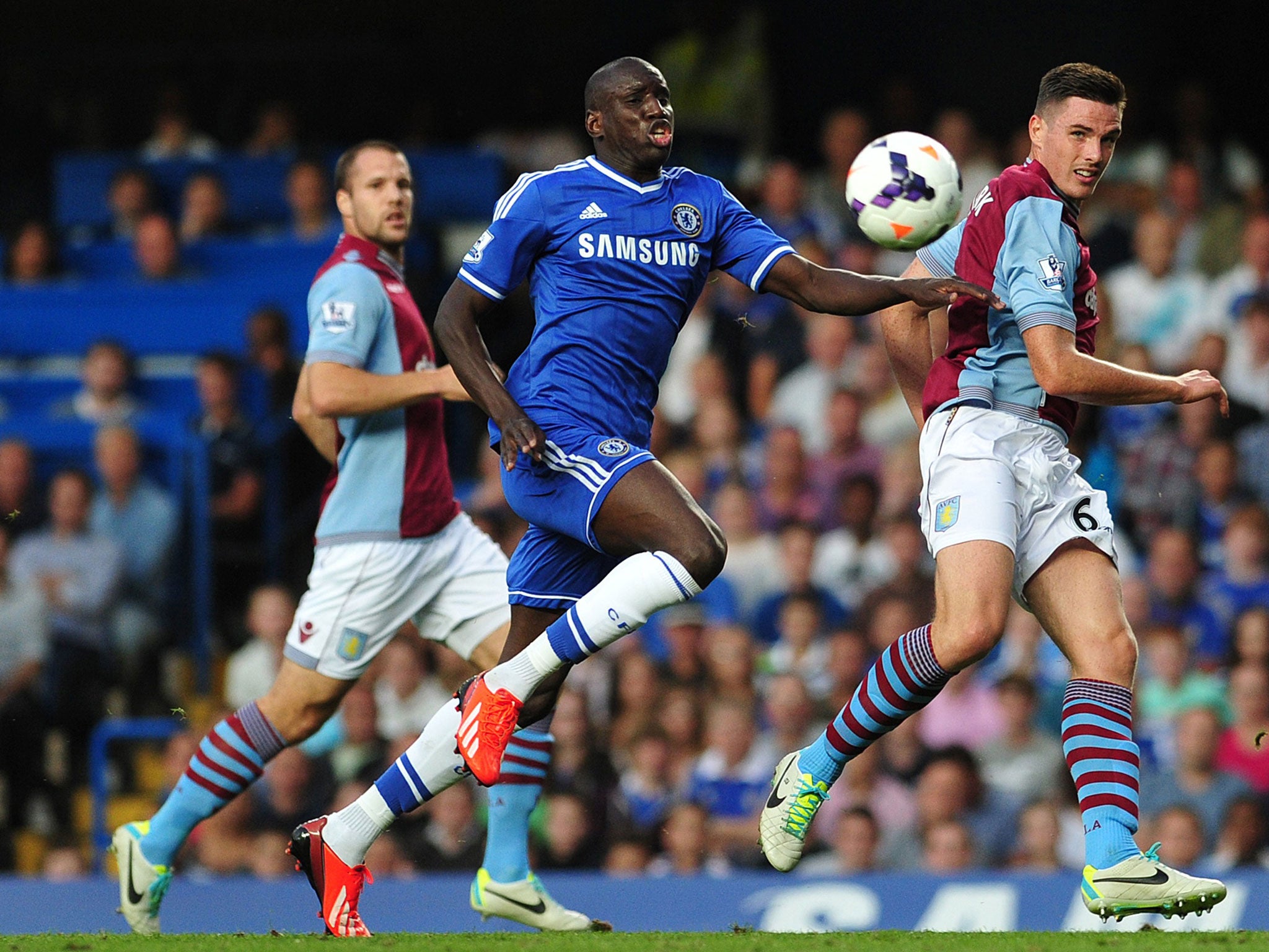 Demba Ba vies with Aston Villa's Ciaran Clark