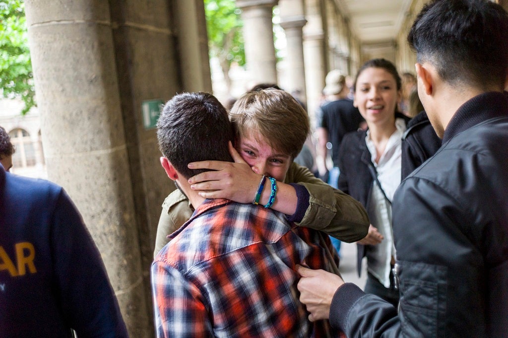 Hugs all round for friends celebrating their results.