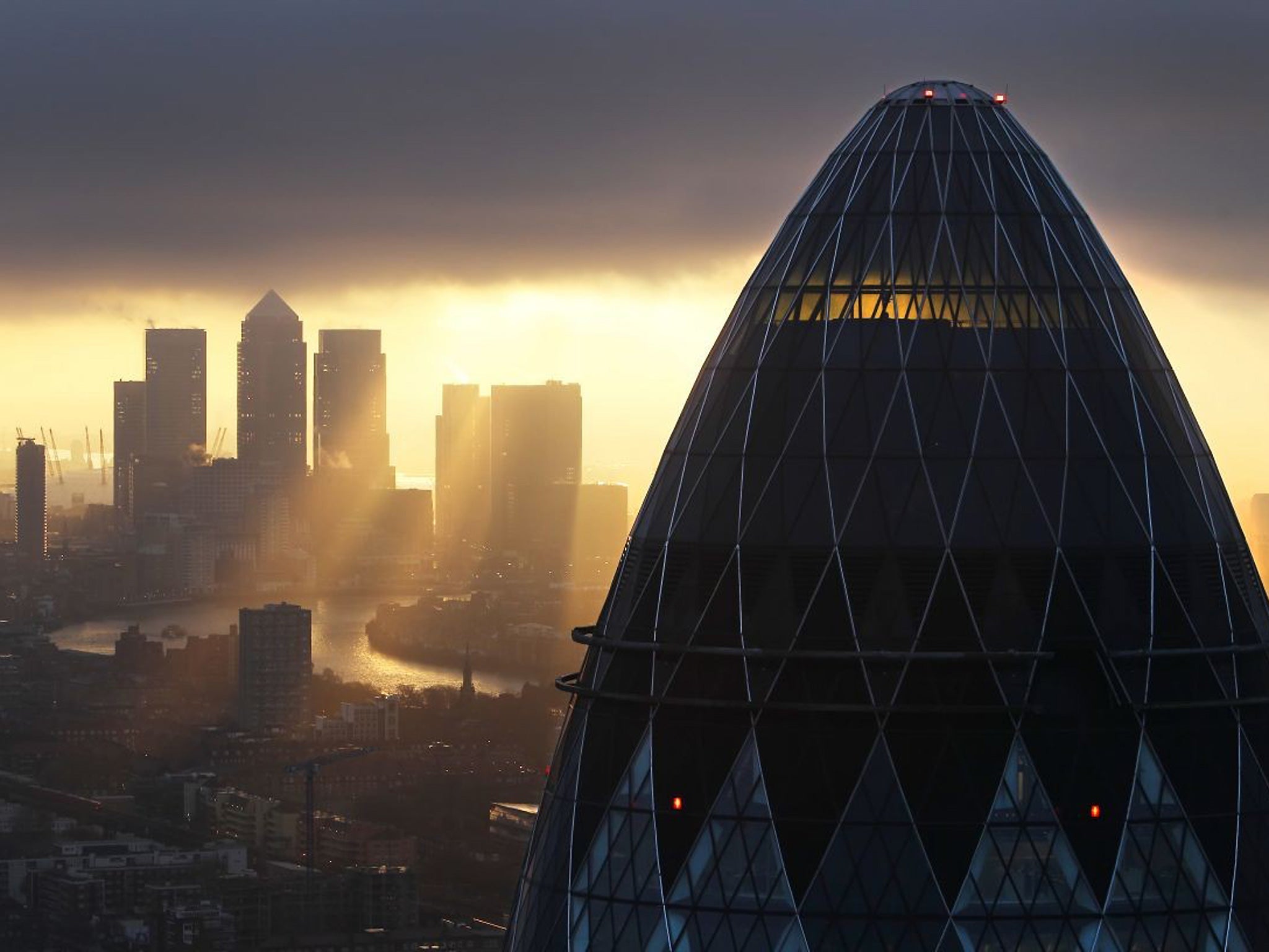 The sun rises over the City of London