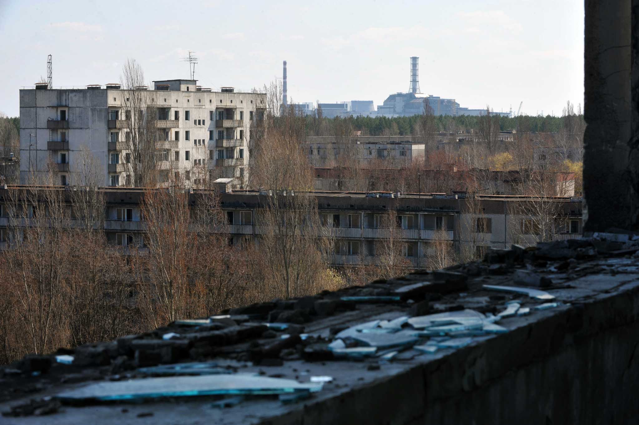 Decay of nature: the exploded reactor at the Chernobyl plant, seen from the ghost city of Pripyat