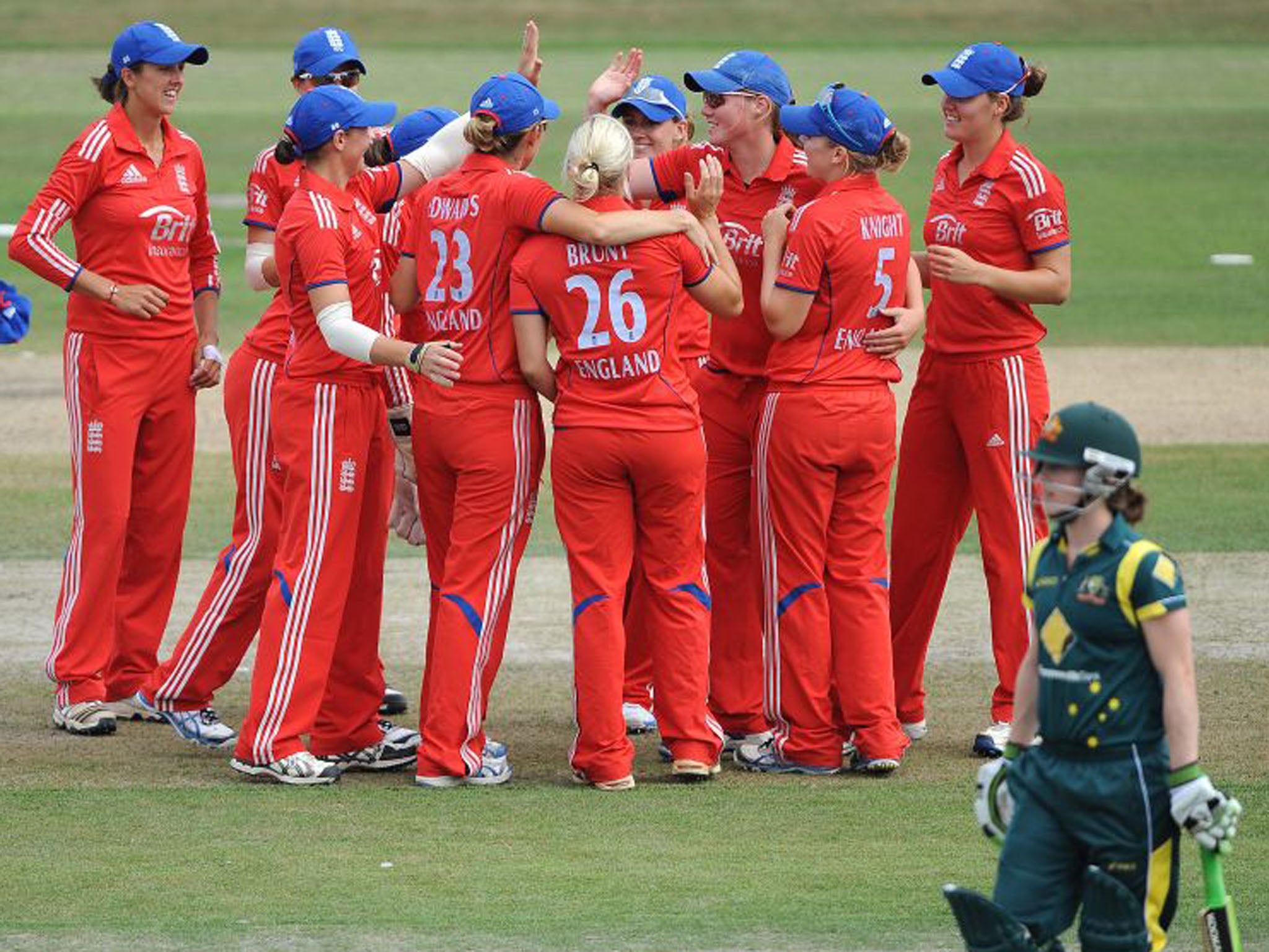 The England team celebrate a Katherine Brunt wicket on their way to victory
