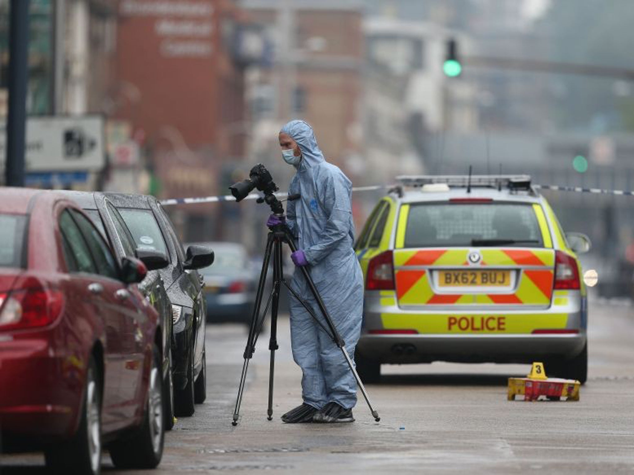 Police at the scene of a shooting in Kilburn High Road,