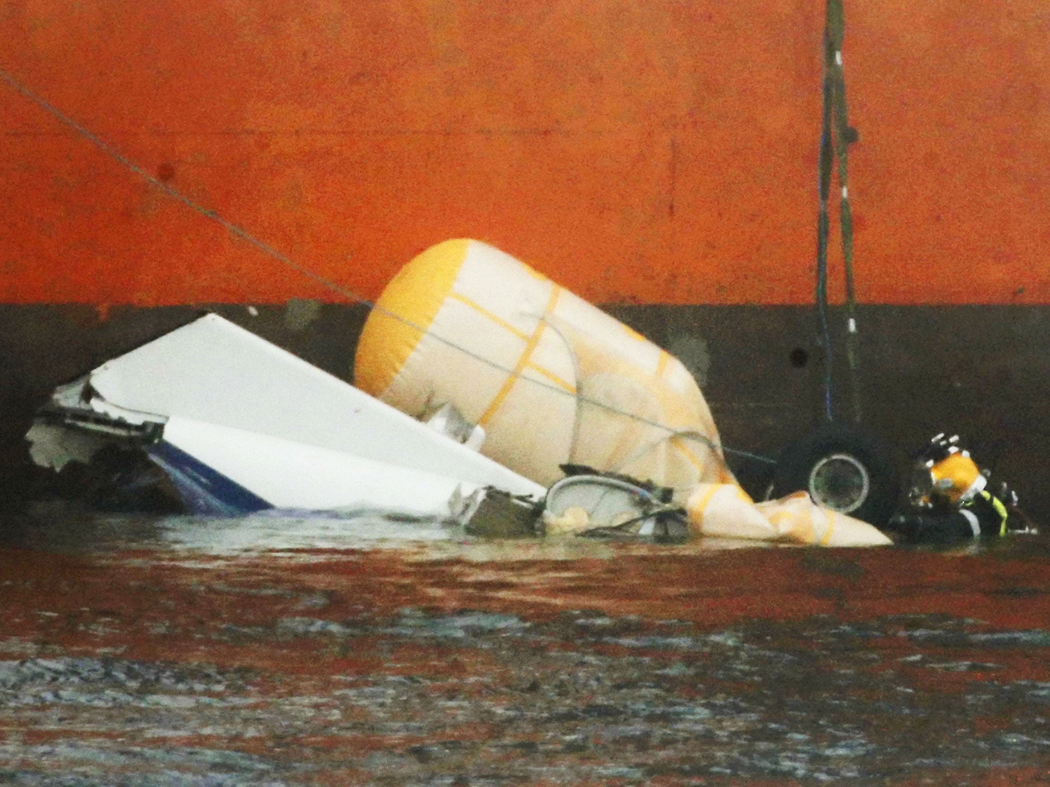 A diver works on the wreckage of the Super Puma helicopter which went down in the North Sea