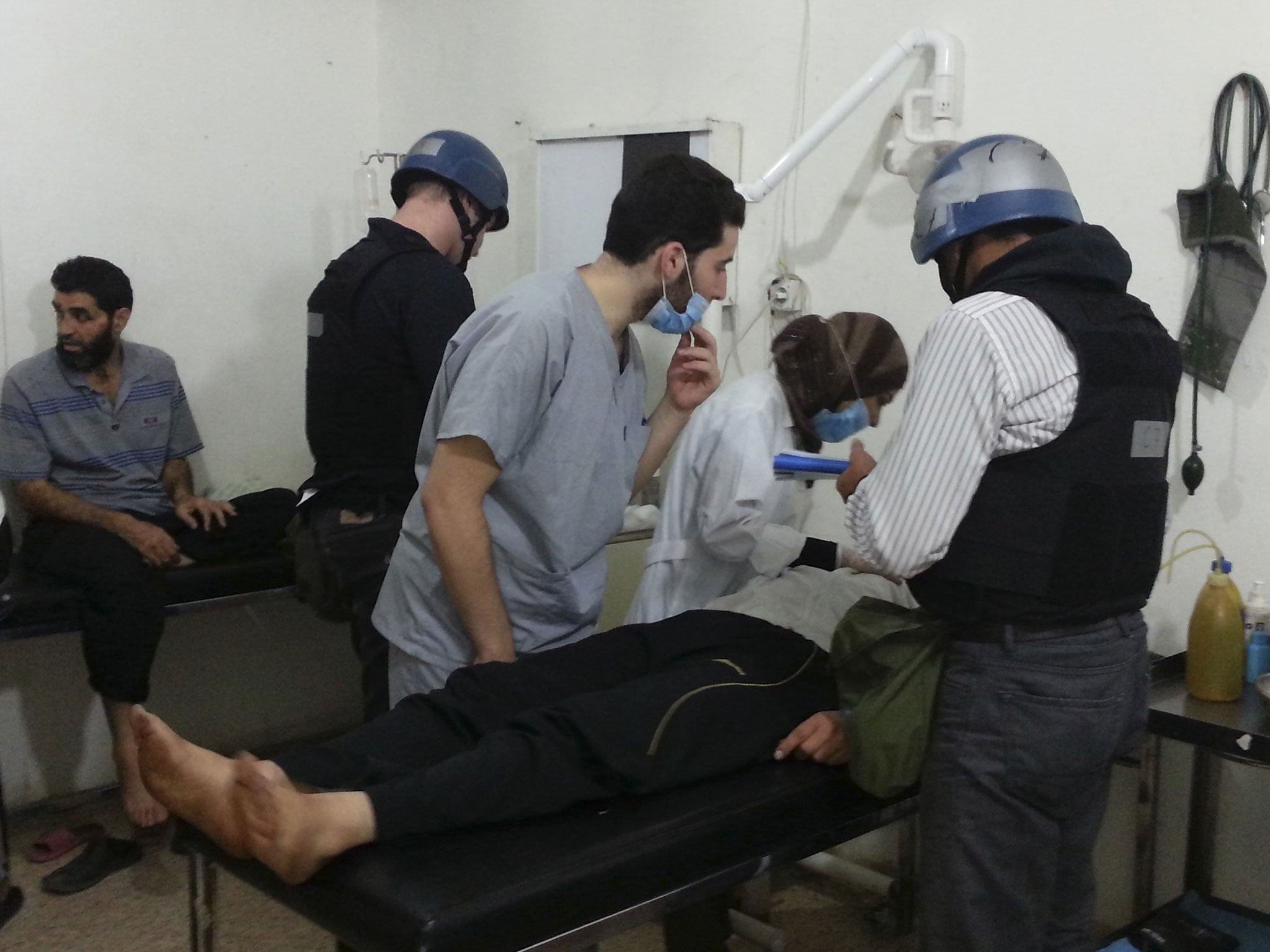 U.N. chemical weapons experts visit people affected by an apparent gas attack