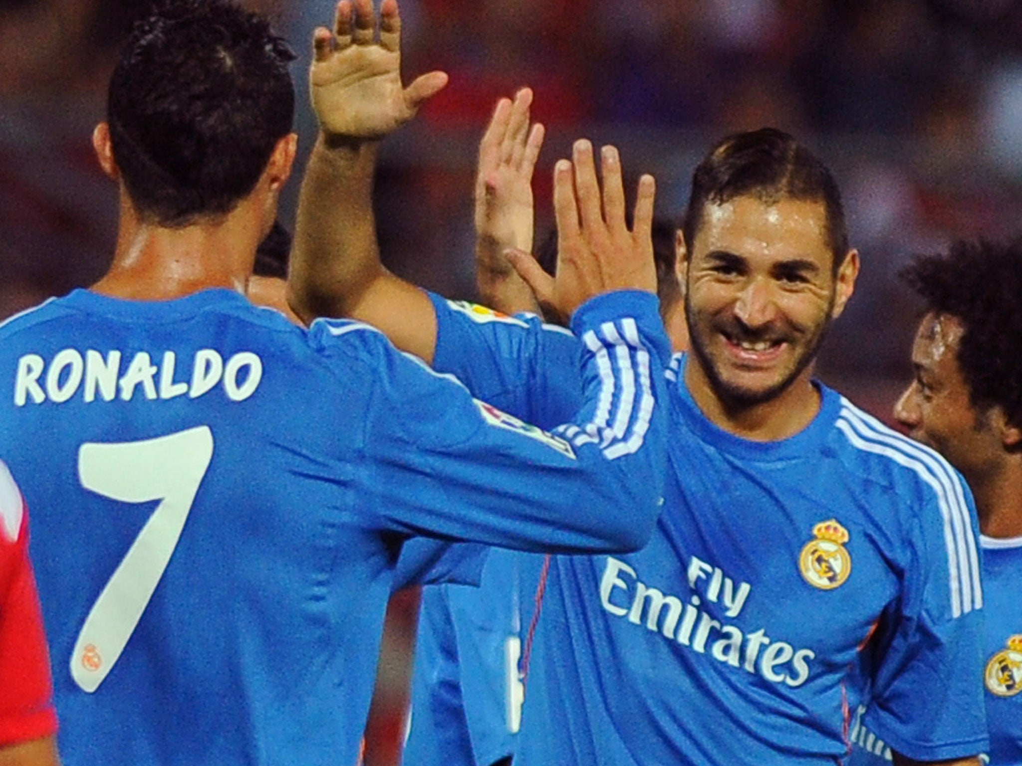 Karim Benzema celebrates his goal against Granada with Cristiano Ronaldo