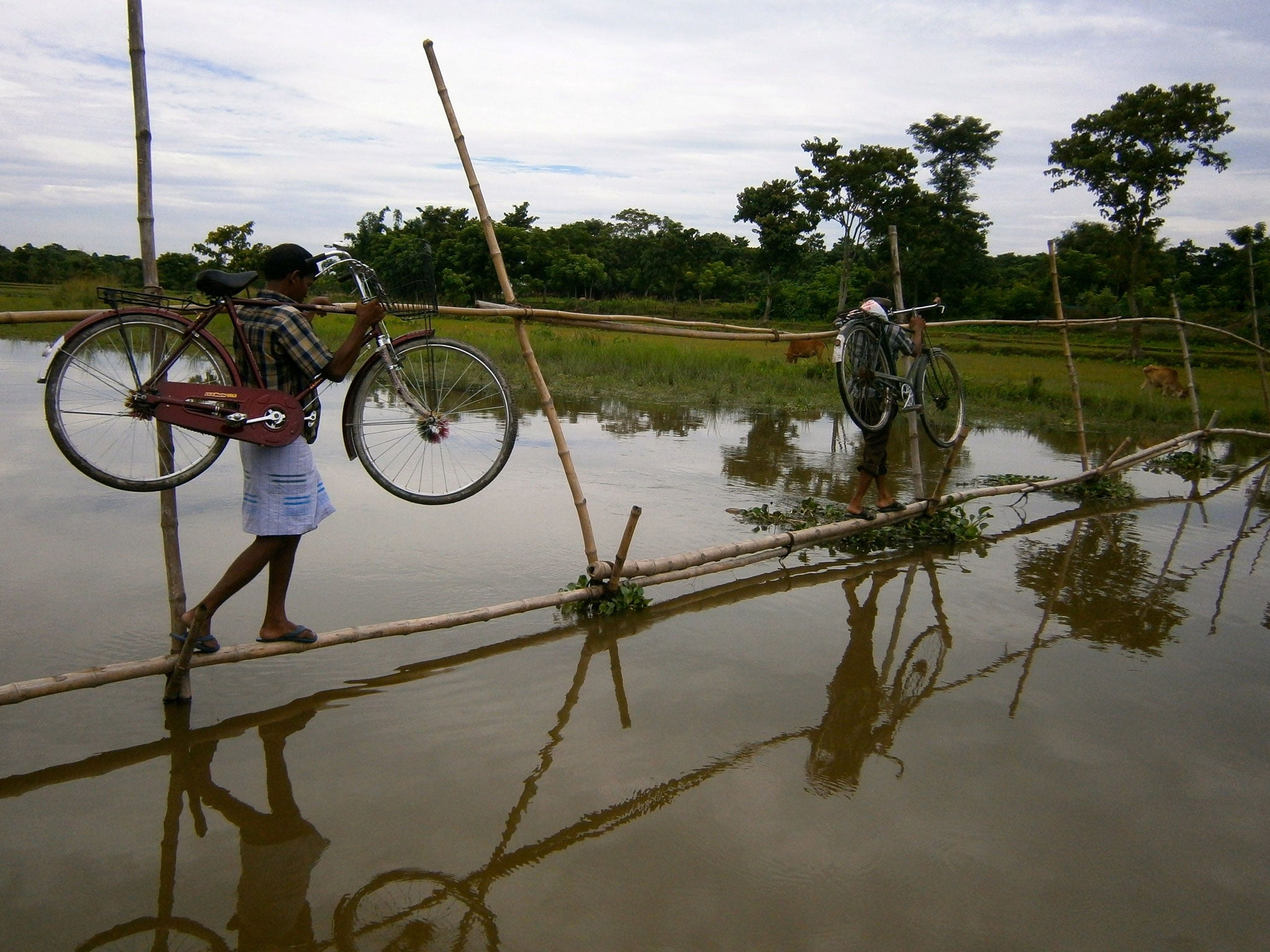 Residents leave the Bangladeshi enclave of Poaturkuthi for 'mainland' India