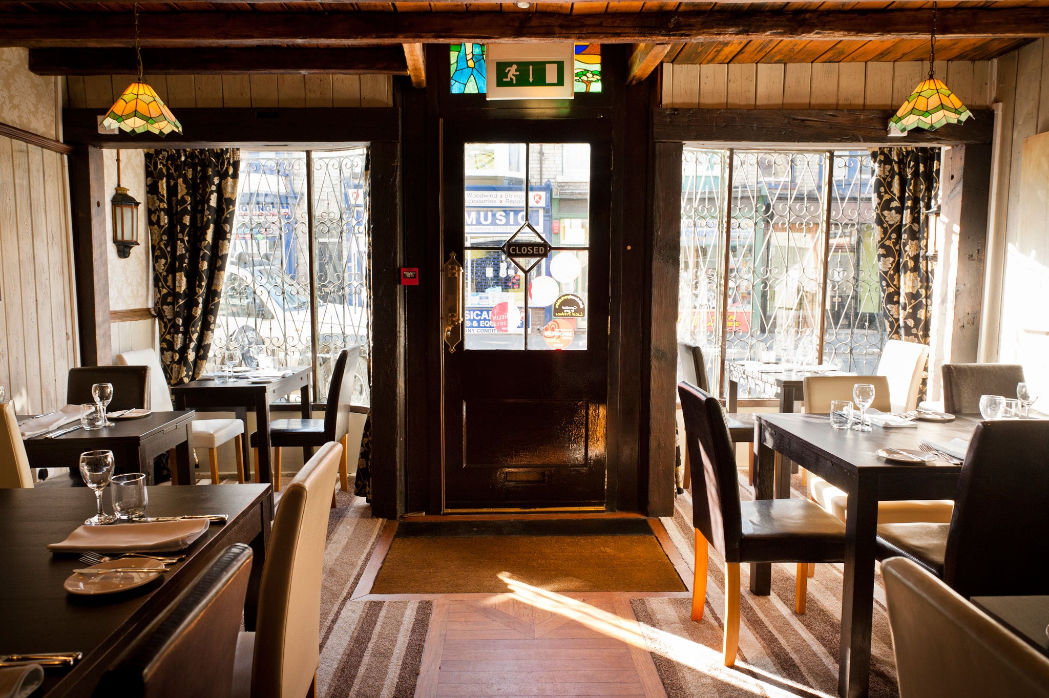 With a polished wooden ceiling and a defunct enamelled range in one corner, The Green Room's interior might be a film set for a French bistro