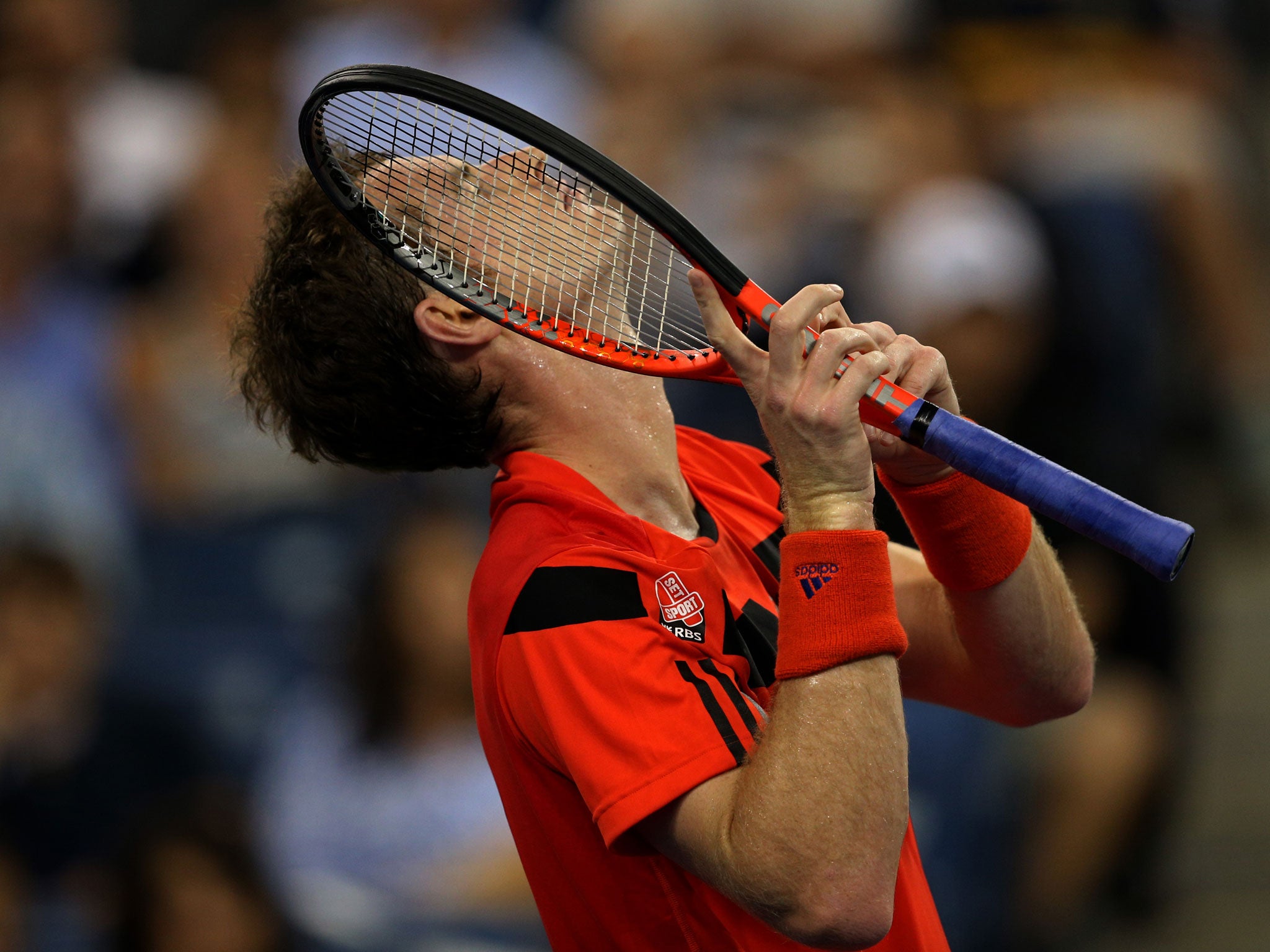 NEW YORK, NY - AUGUST 28: Andy Murray of Great Britain reacts during his men's singles first round match against Michael Llodra of France on Day Three of the 2013 US Open. GETTY IMAGES