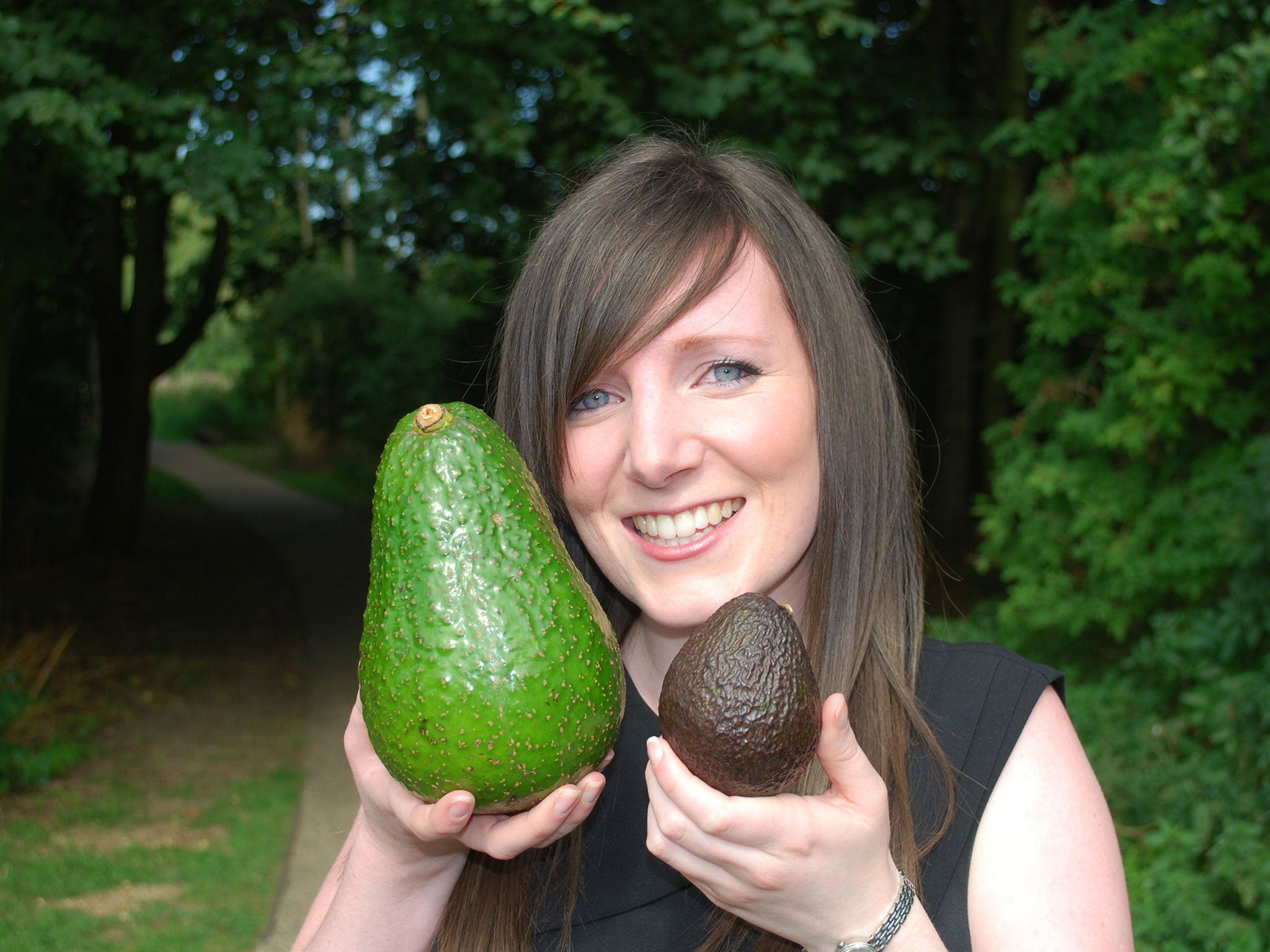 Tesco salads buyer Emma Bonny holding the rare 'Avozilla' avocado