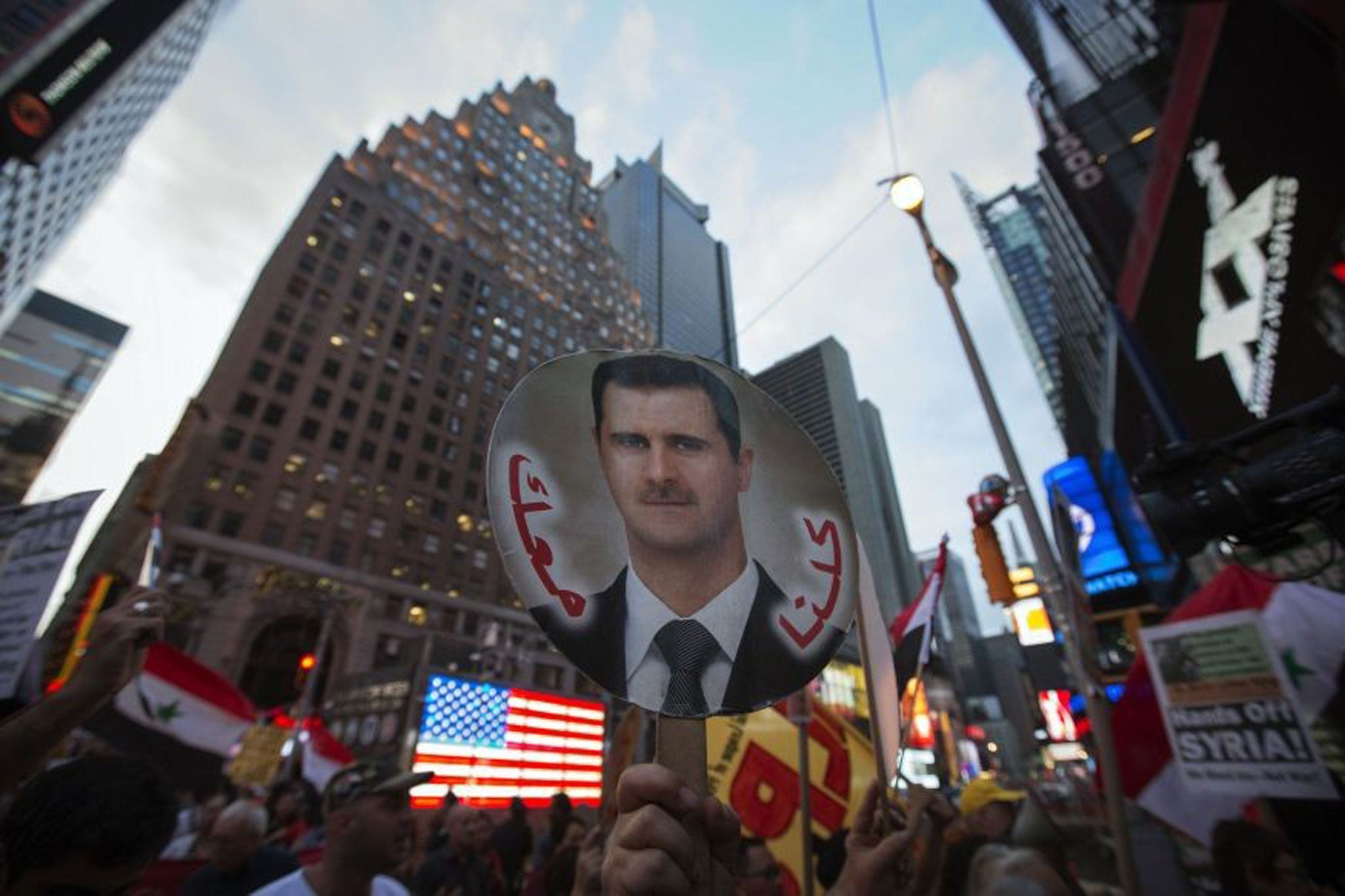 Syrian-American supporters of President Bashar al-Assad stage an anti-war rally in New York