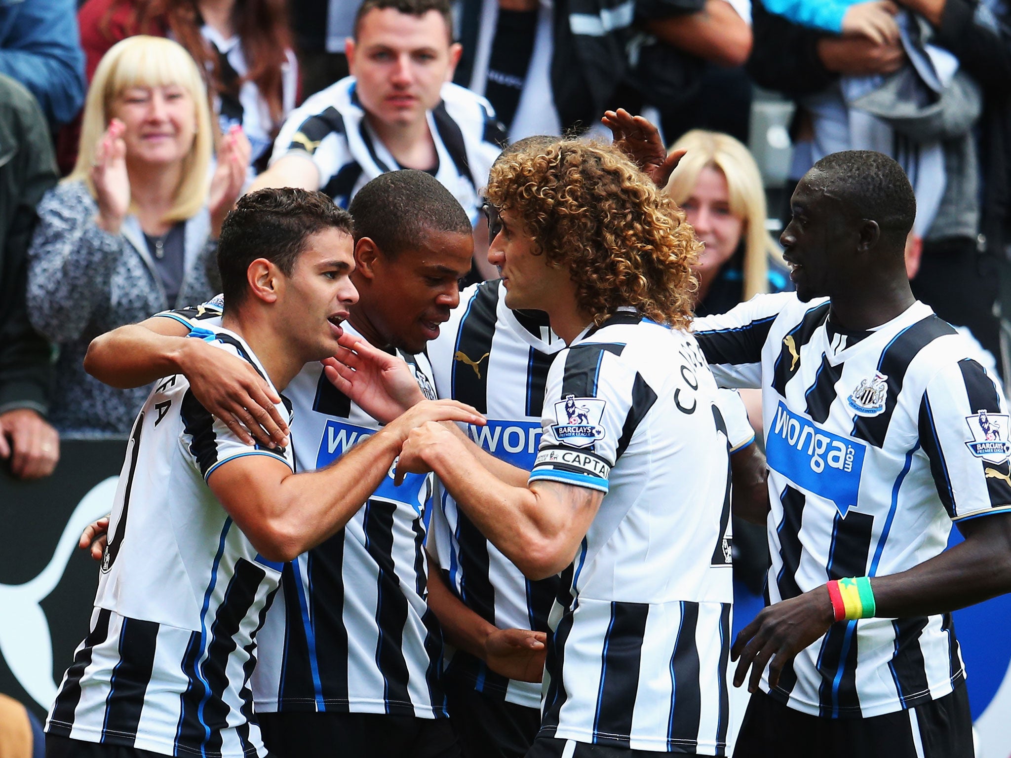 Hatem Ben Arfa (L) of Newcastle United celebrates scoring the opening goal