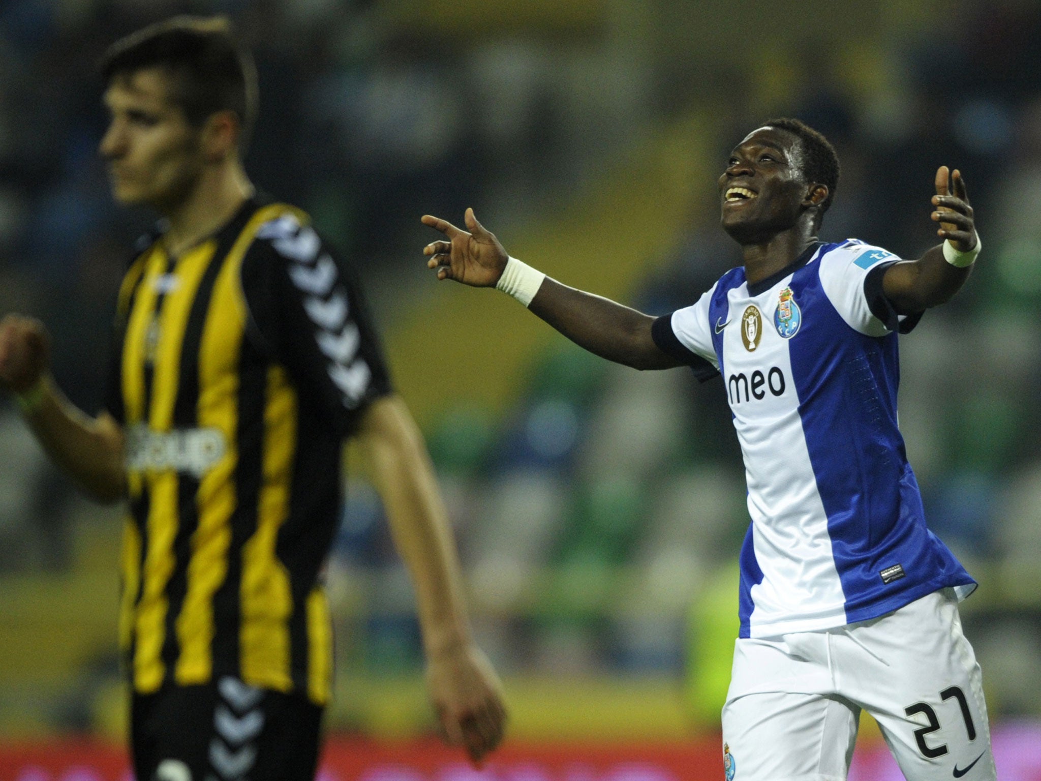 Porto's Ghanaian forward Christian Atsu (R) celebrates after scoring during the Portuguese league football match Beira Mar vs Porto