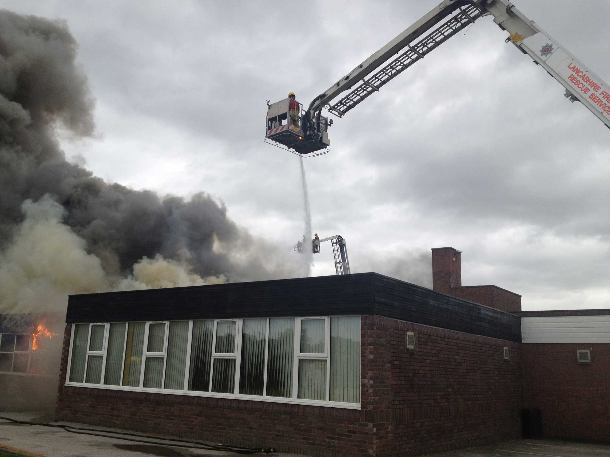 Fire fighters tackle a blaze at Leyland St Mary's Catholic Technology College