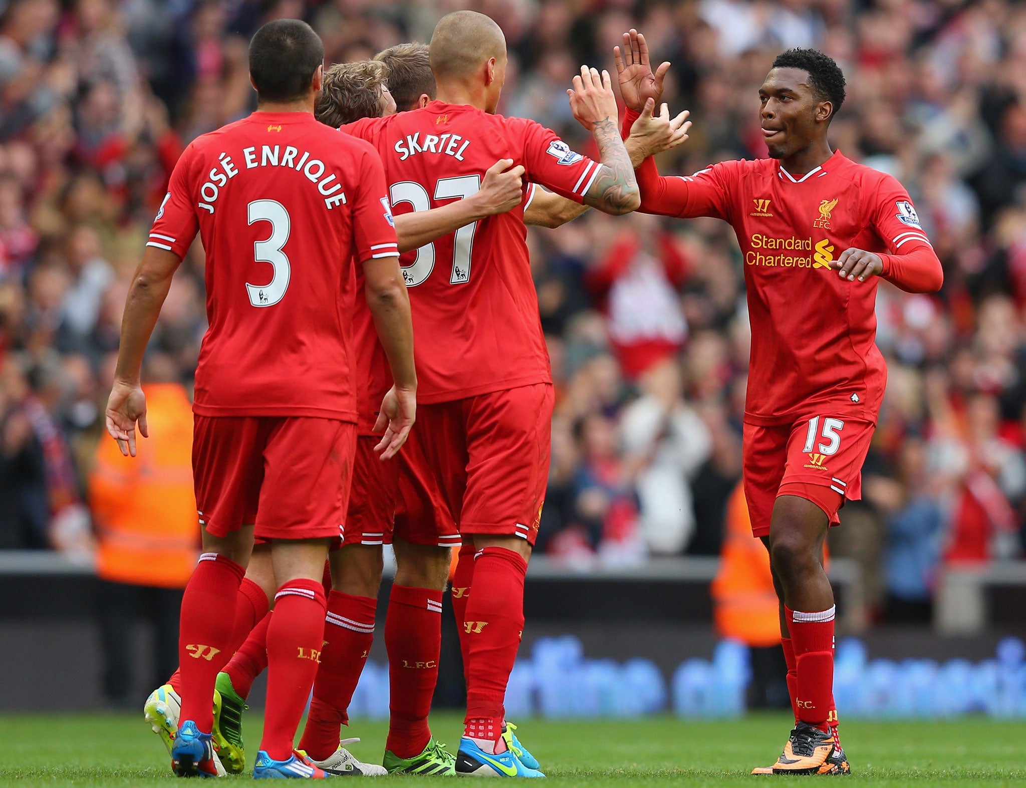 Daniel Sturridge celebrates with his team-mates