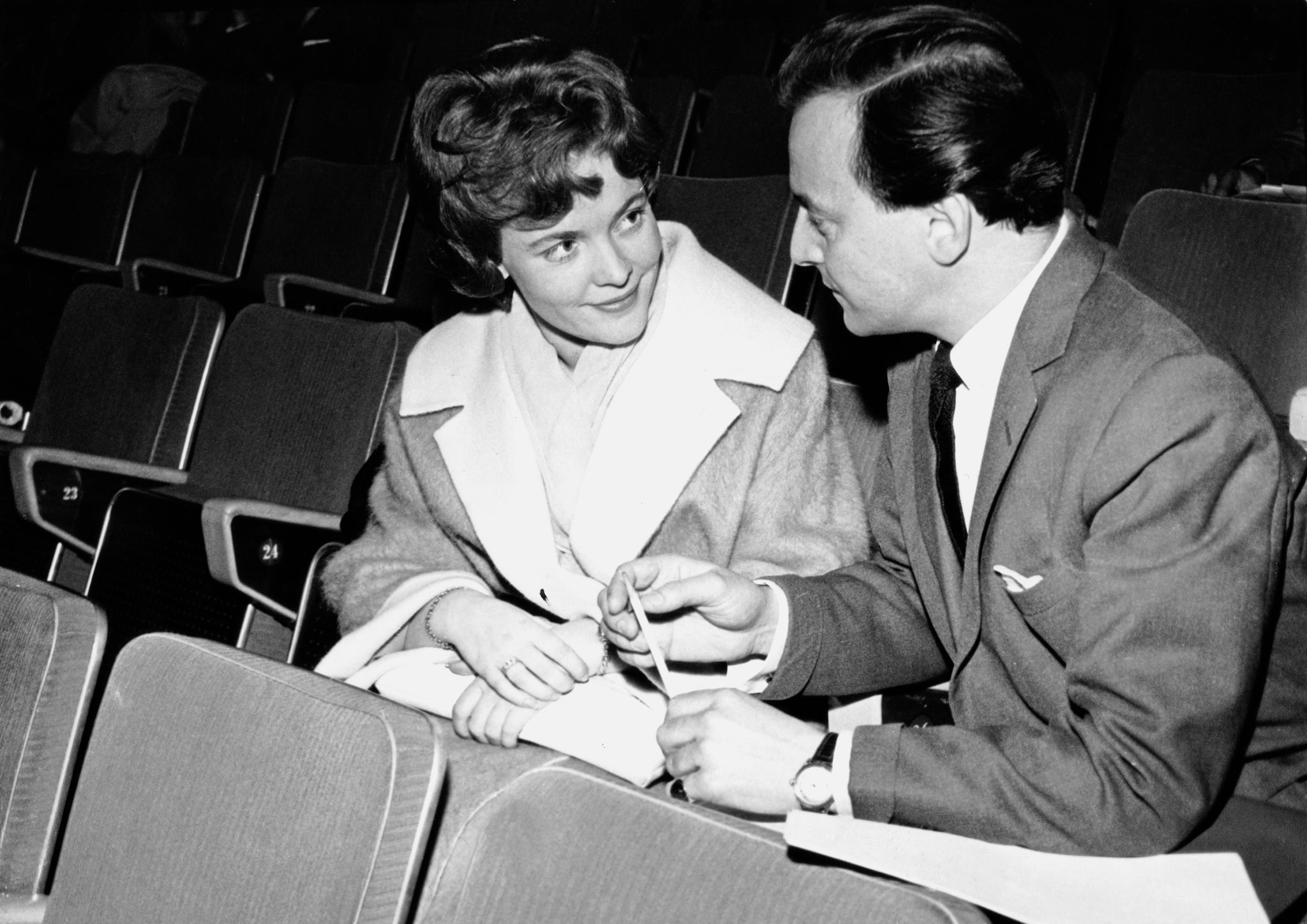 Eurovision Song Contest entrant Katy Bodtger of Denmark talks to compere David Jacobs during rehearsals at the Royal Festival Hall in London, 28th March 1960.