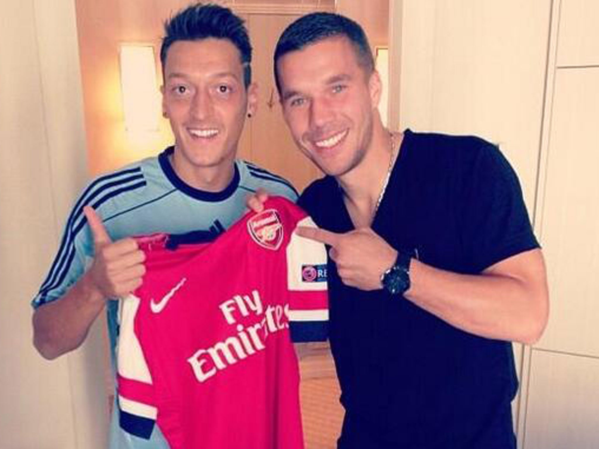 Ozil and Podolski were pictured together after the midfielder had completed his move to Arsenal