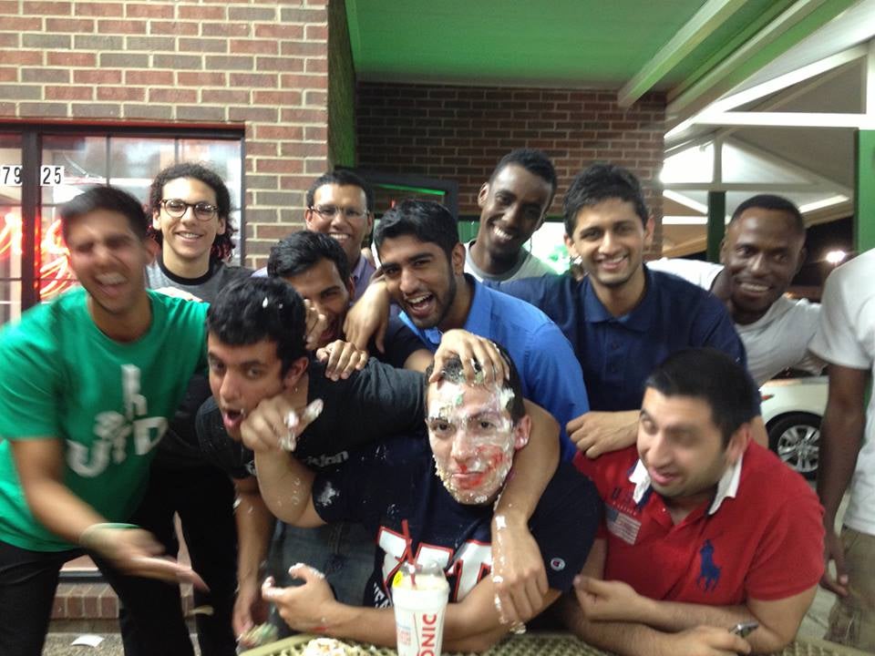 Cake in the face for Imran, one of the fraternity's first alumni (Facebook)