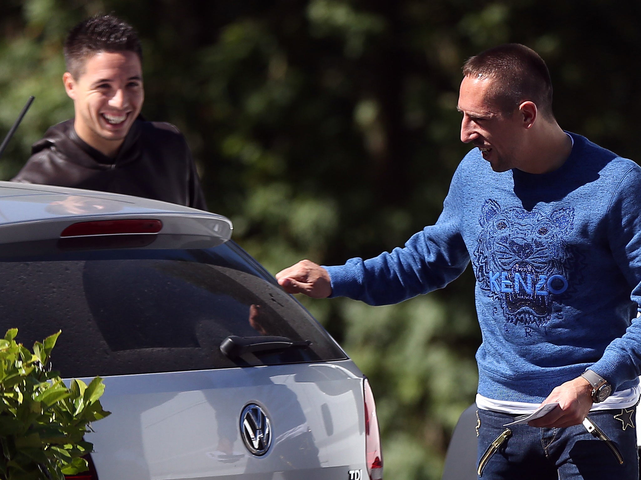 French forward Franck Ribery (R) speaks with midfielder Samir Nasri at the French national football team training base in Clairefontaine