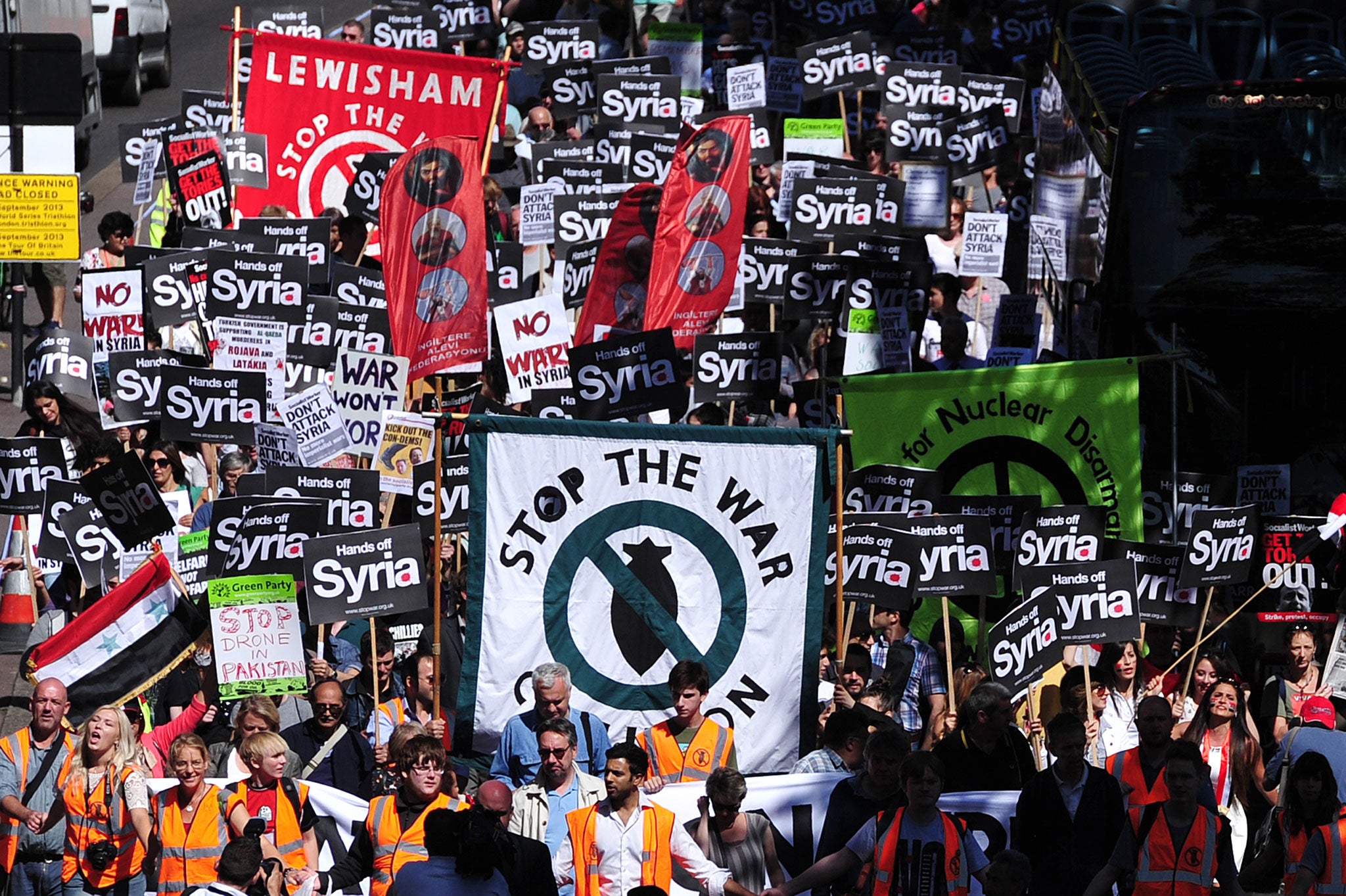 Hundreds of people protest against military intervention in Syria in central London on August 31