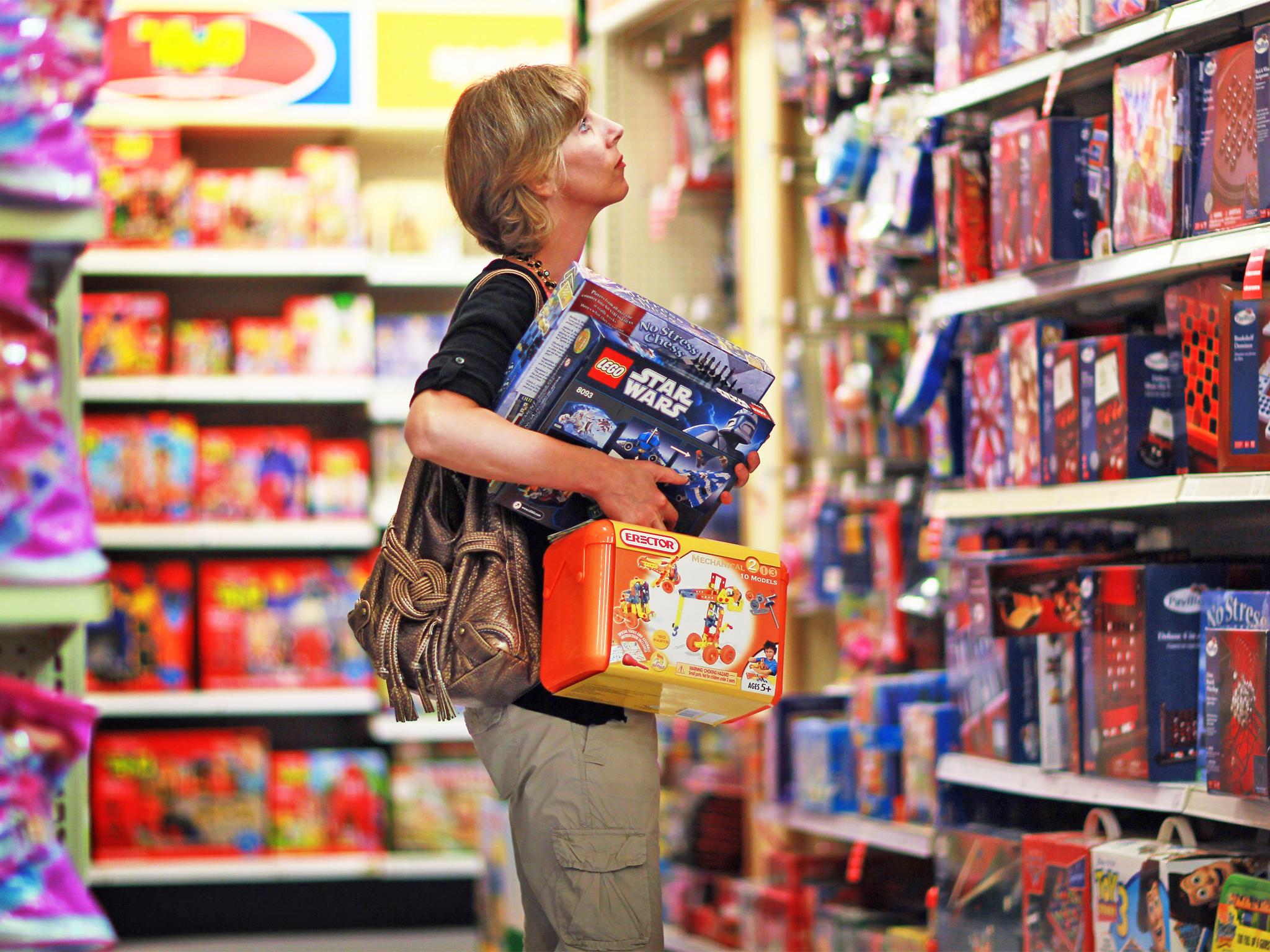 A shopper browses a Toys R Us store