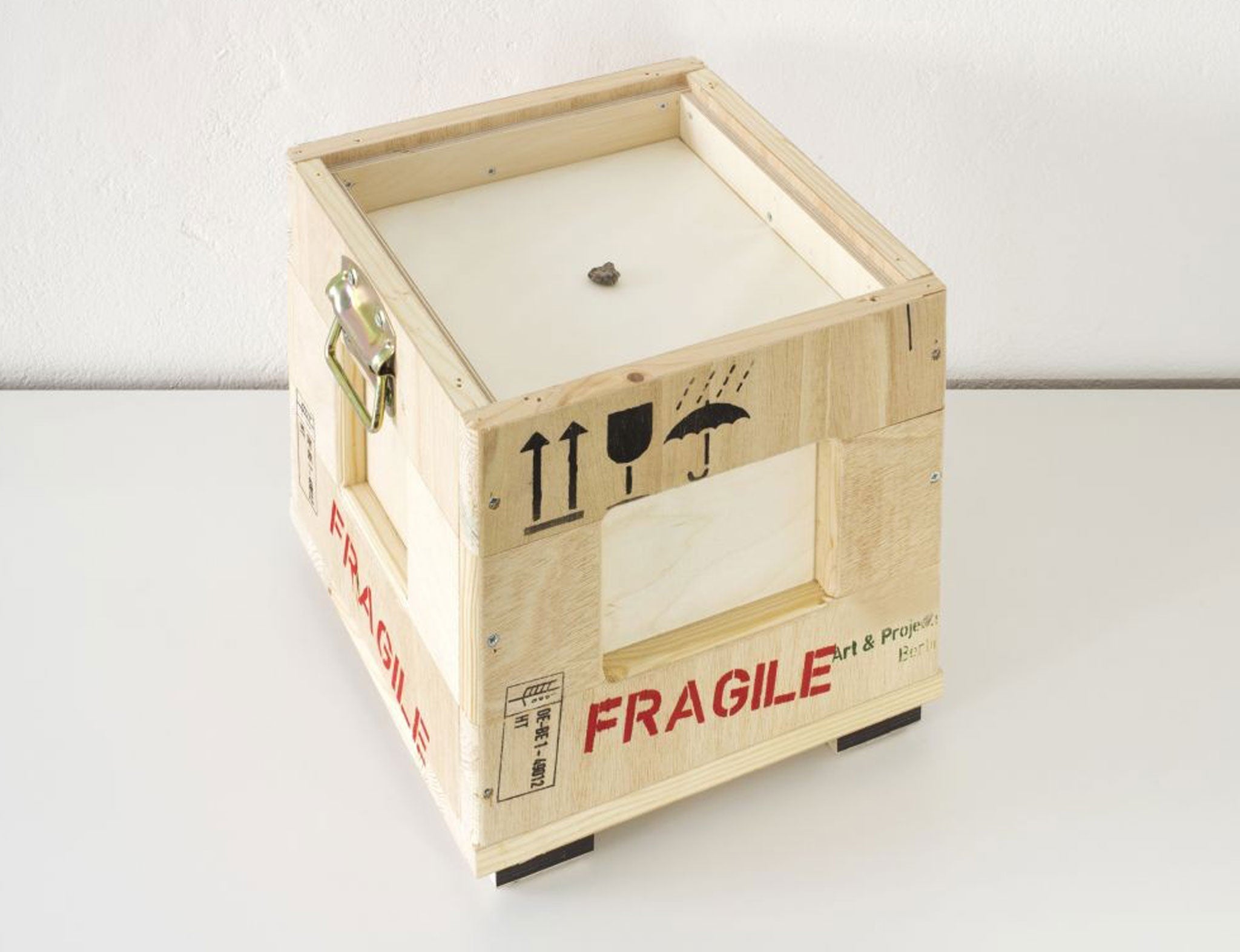 A fragment of the moon will be taken by air freight courier around the Earth in a box (pictured) for one year, as part of Katie Paterson's new artwork Second Moon