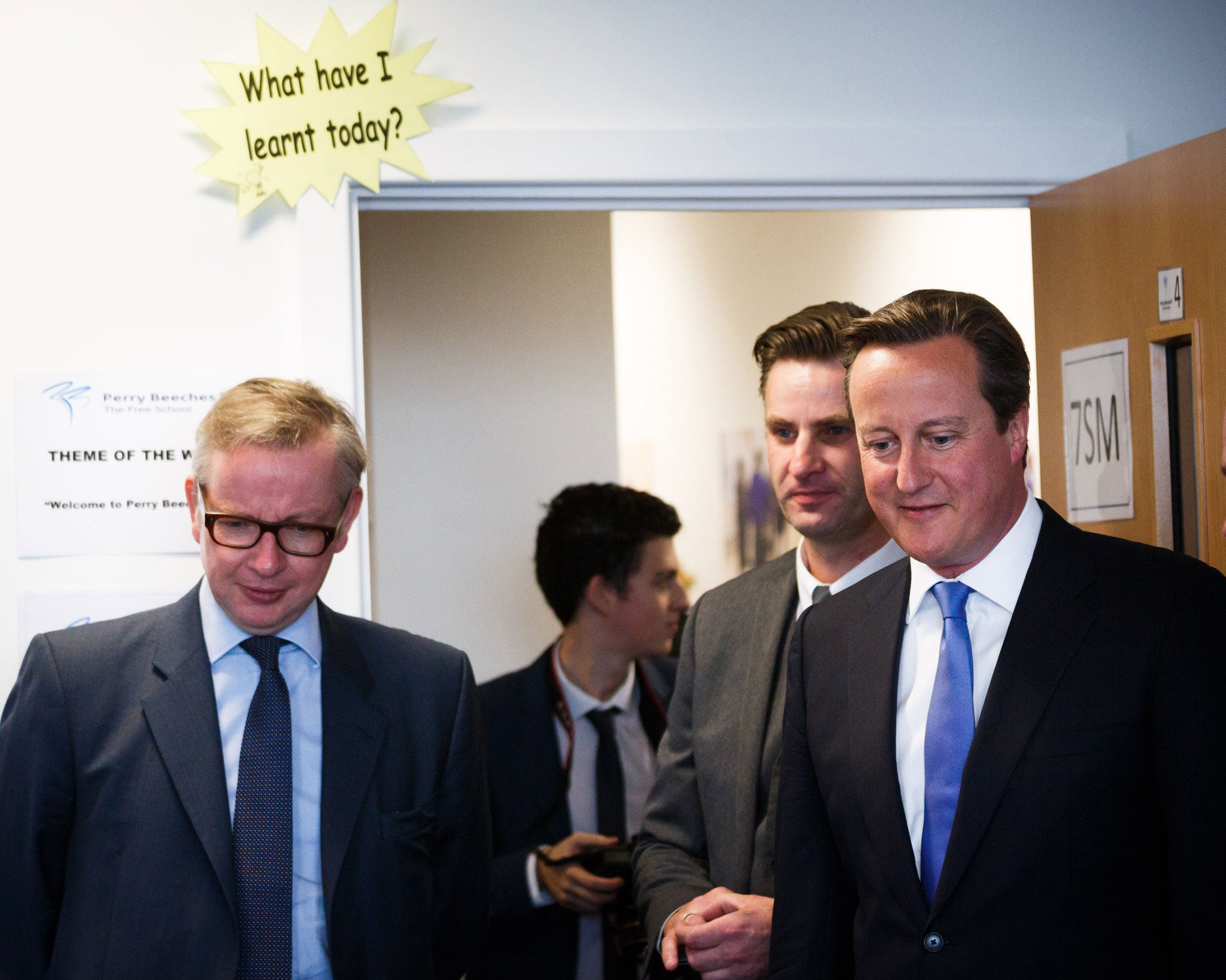 Education Secretary Michael Gove stands by the classroom doorway