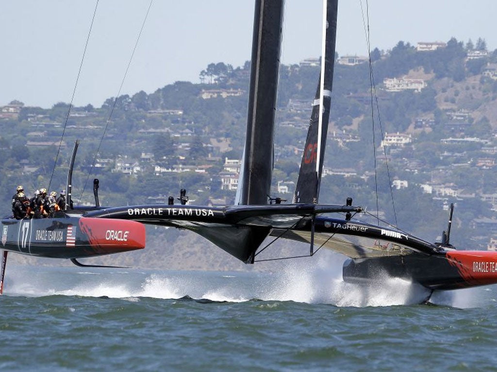 Oracle Team USA foils coming off the start line during training