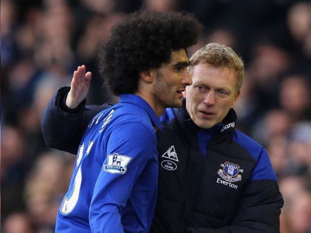 Marouane Fellaini (left) followed David Moyes (right) from Everton to United