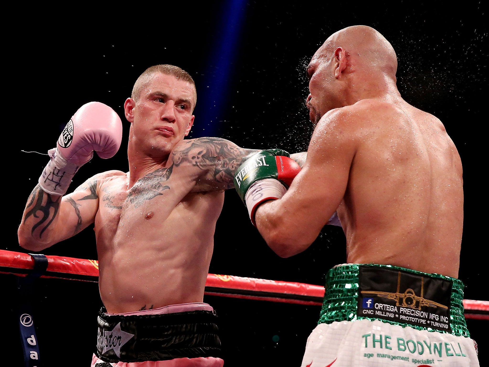 Ricky Burns lands a left jab on Raymundo Beltran during their WBO lightweight title clash in Glasgow