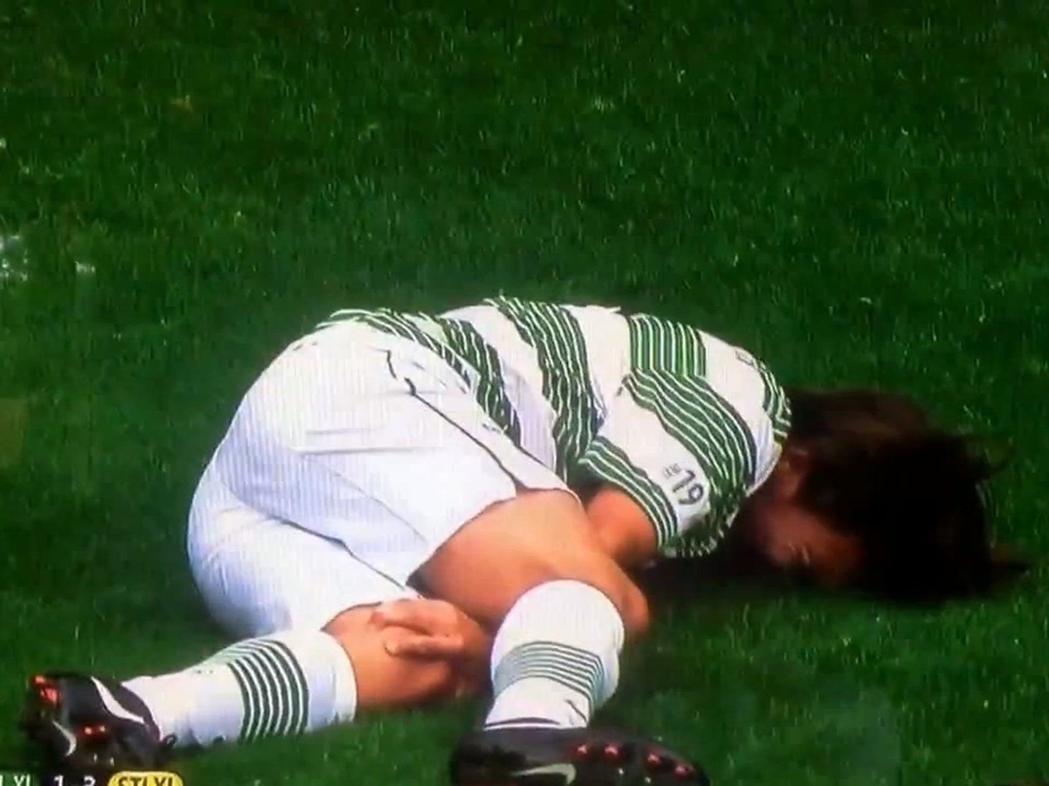 Louis Tomlinson lies injured during Stilyan Petrov's charity match