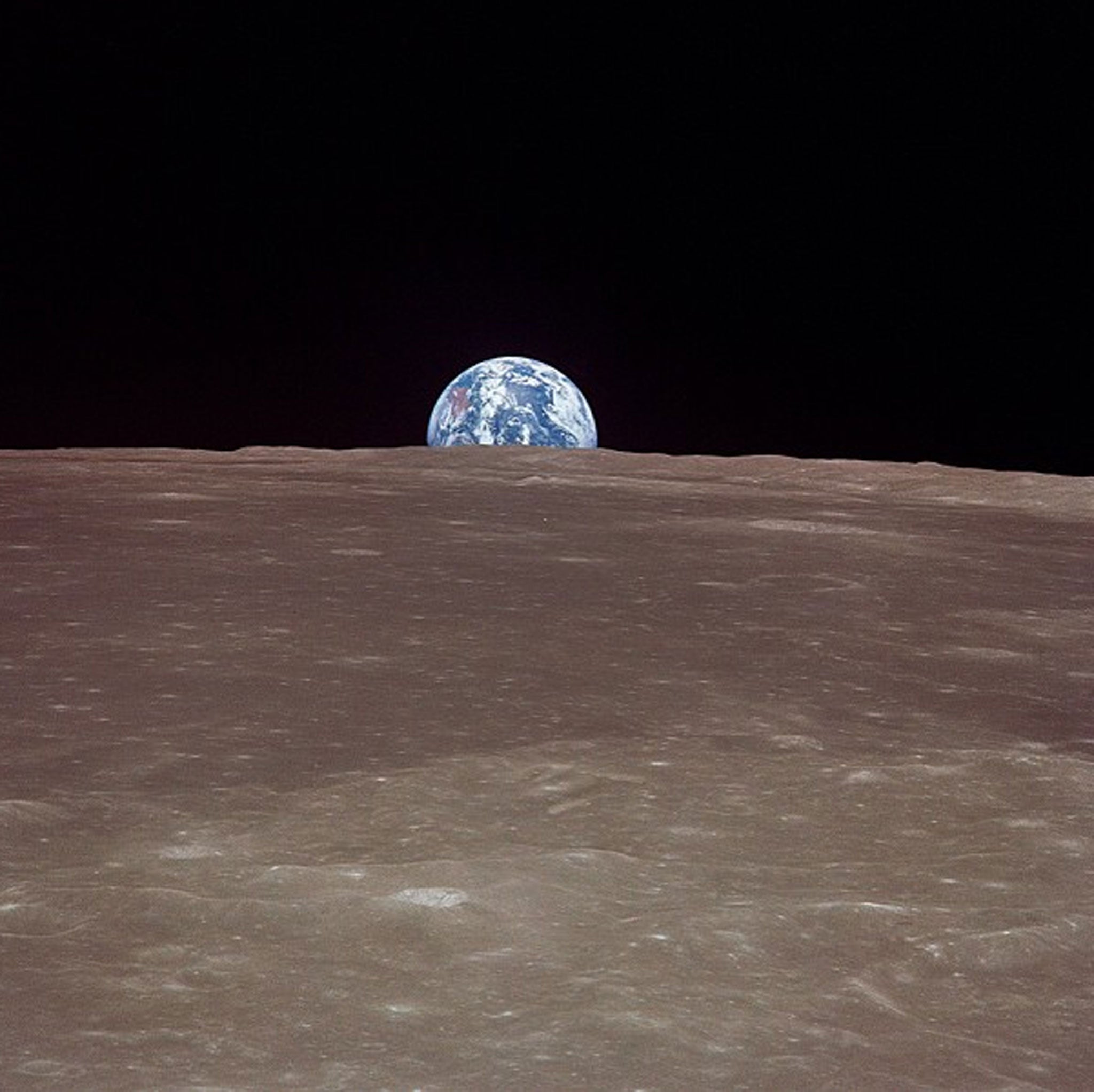 This image, taken 20 July 1969 from Apollo 11 and recently posted to Nasa's Instagram account, shows the Earth rising over the limb of the moon much as the Harvest Moon does from our planetary perspective