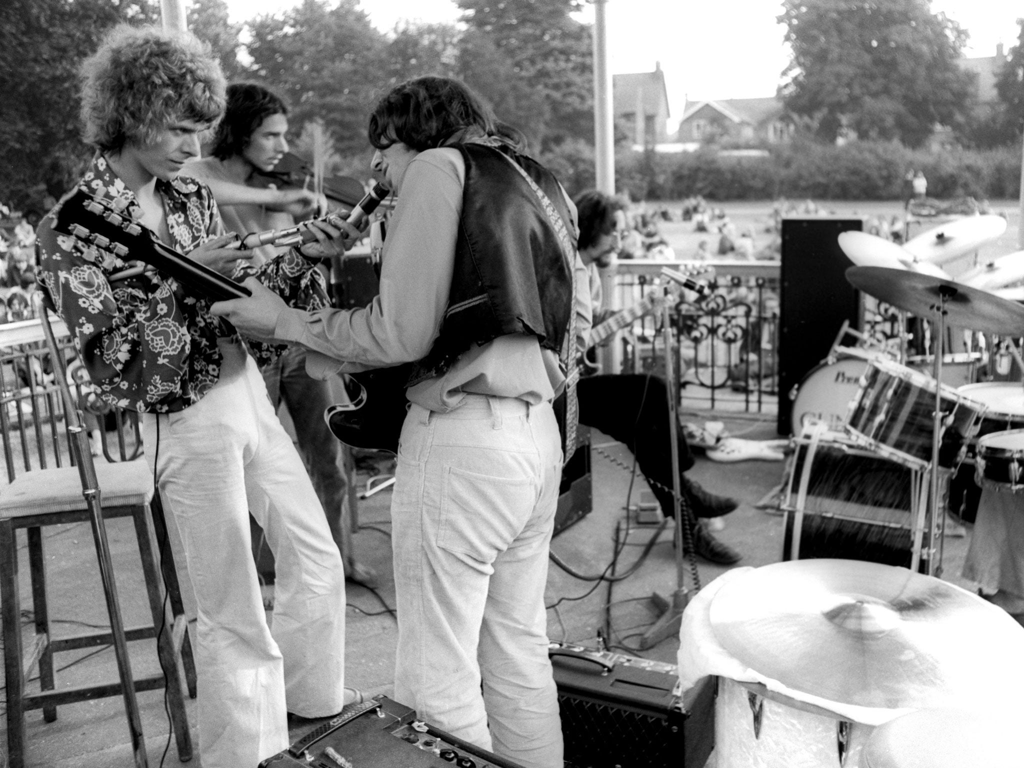David Bowie, far left, gives his free concert at Croydon Road bandstand in Beckenham in 1969
