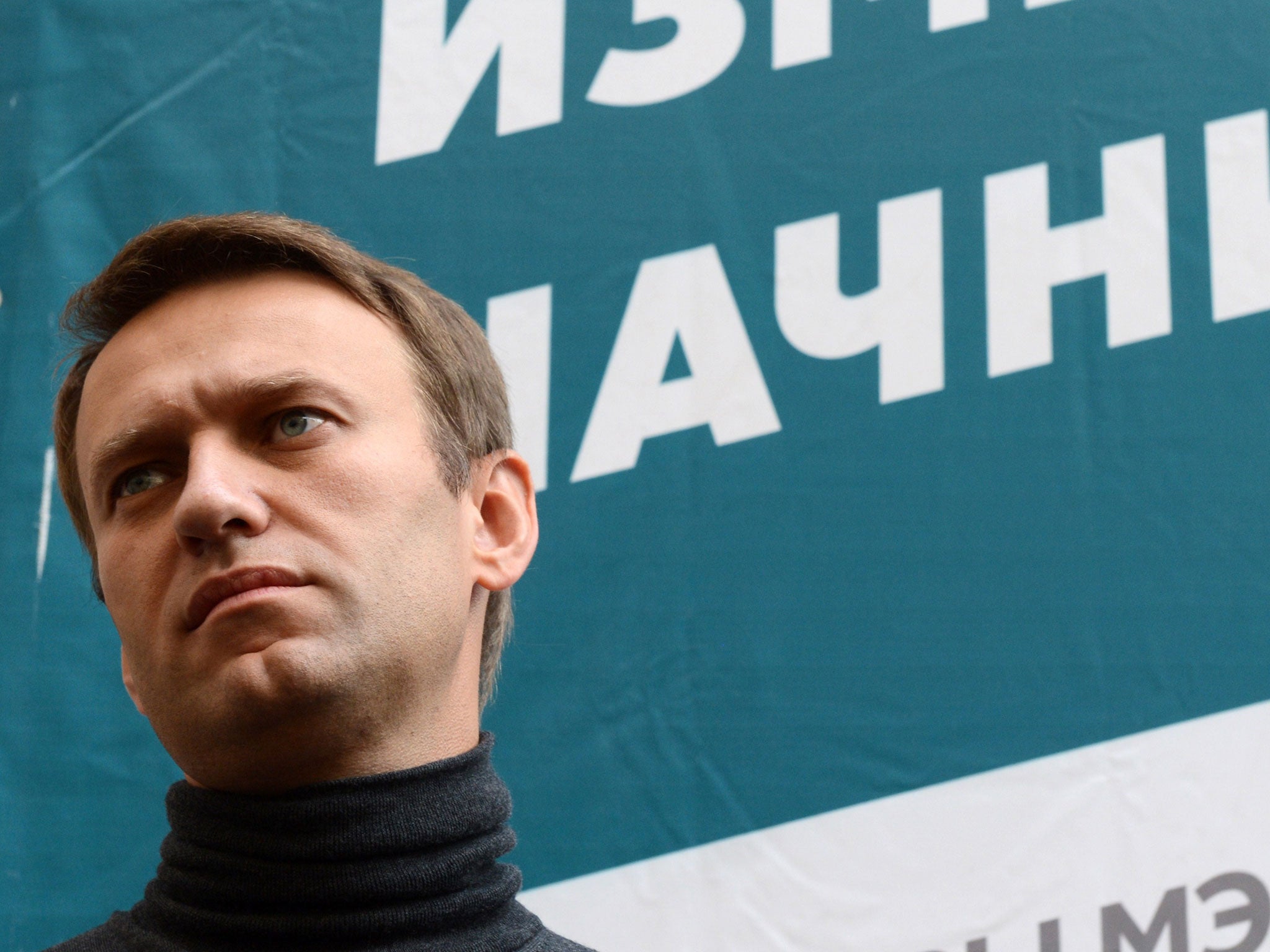 Alexei Navalny speaks to the press outside his headquarters in Moscow, Russia