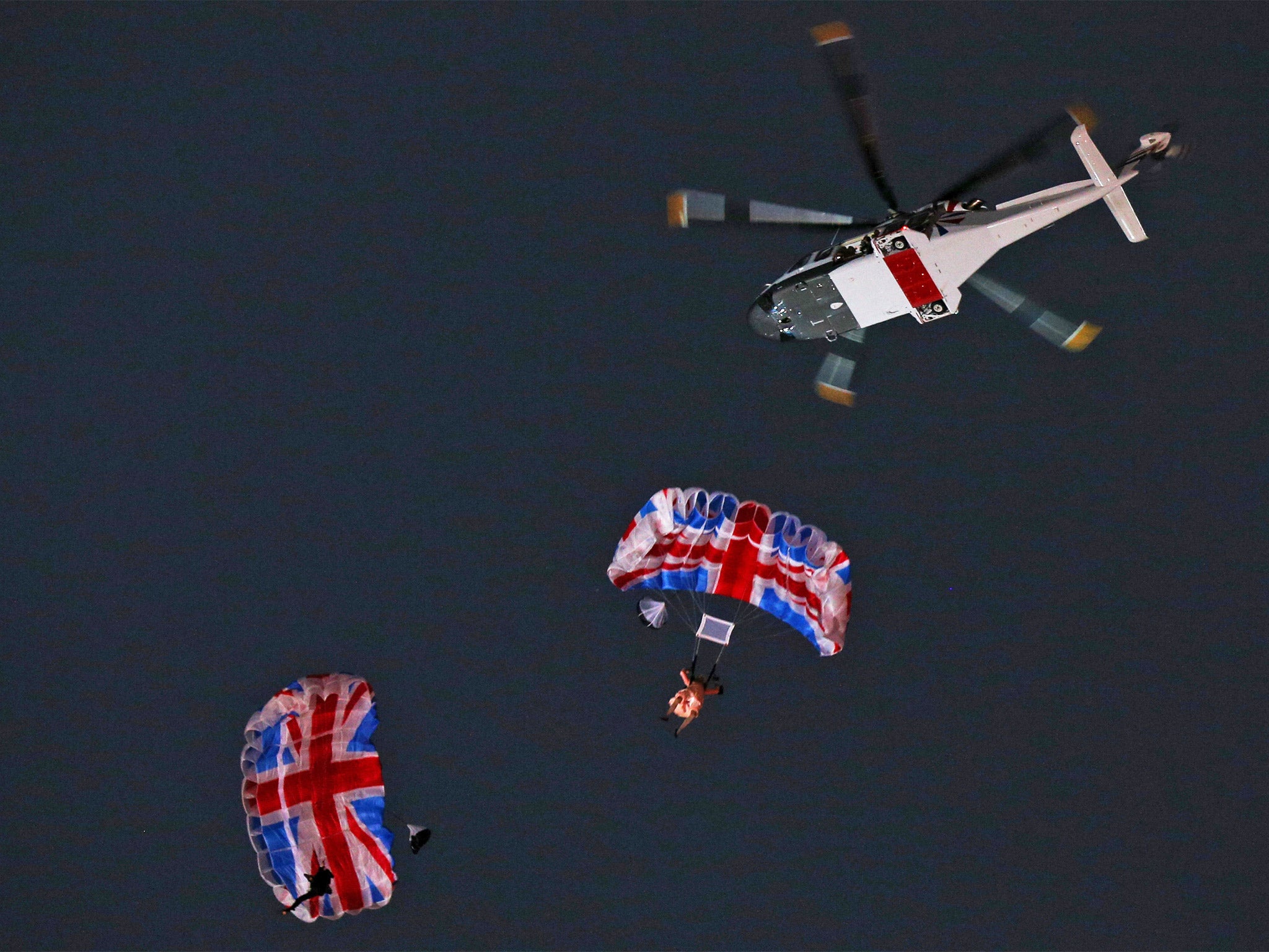 Sutton, left, and Gary Connery as the Queen on their way down to the Olympic Opening Ceremony