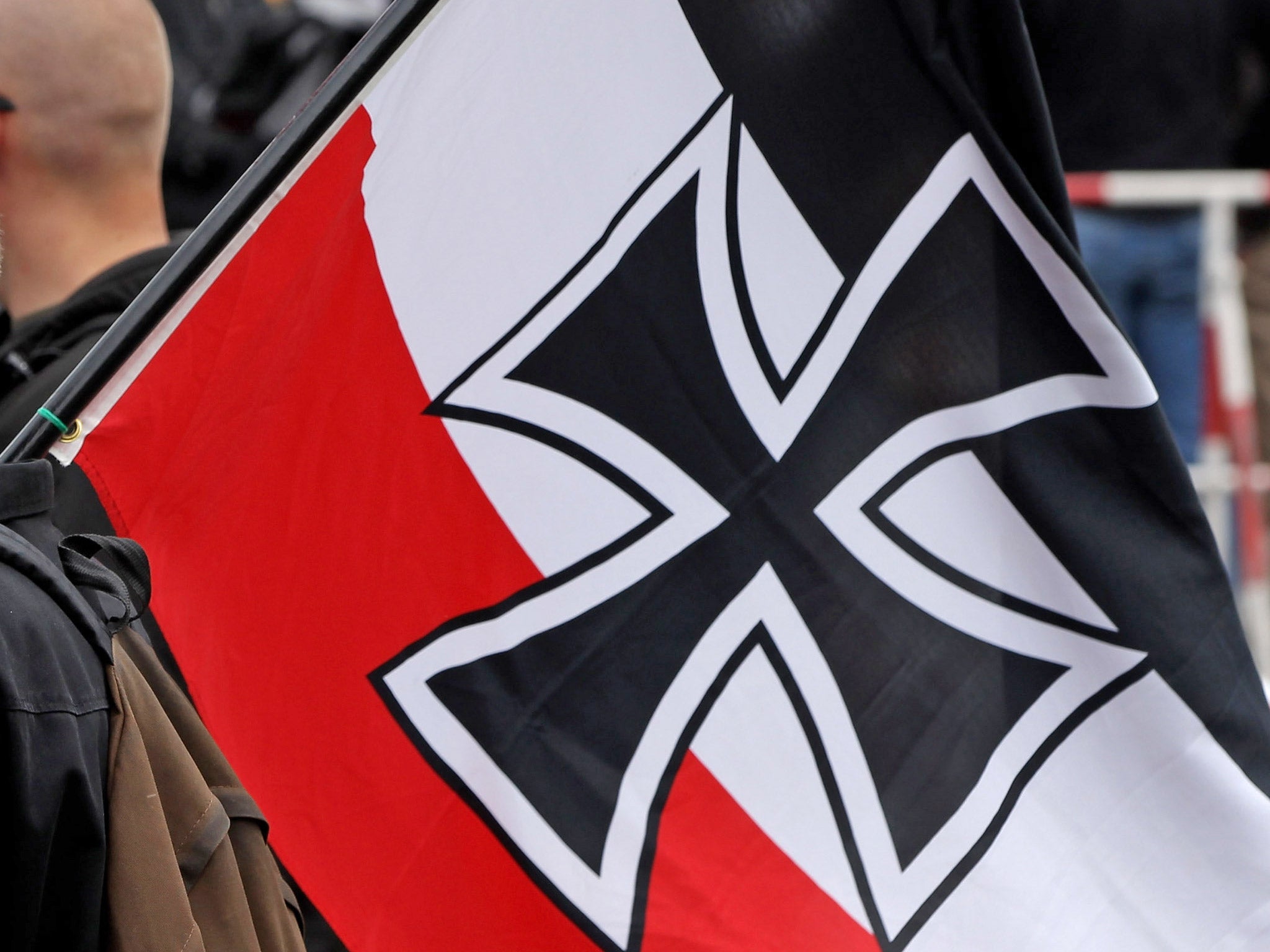 A neo-Nazi supporter bears the colours of the pre-World War I German Empire at a rally in Berlin