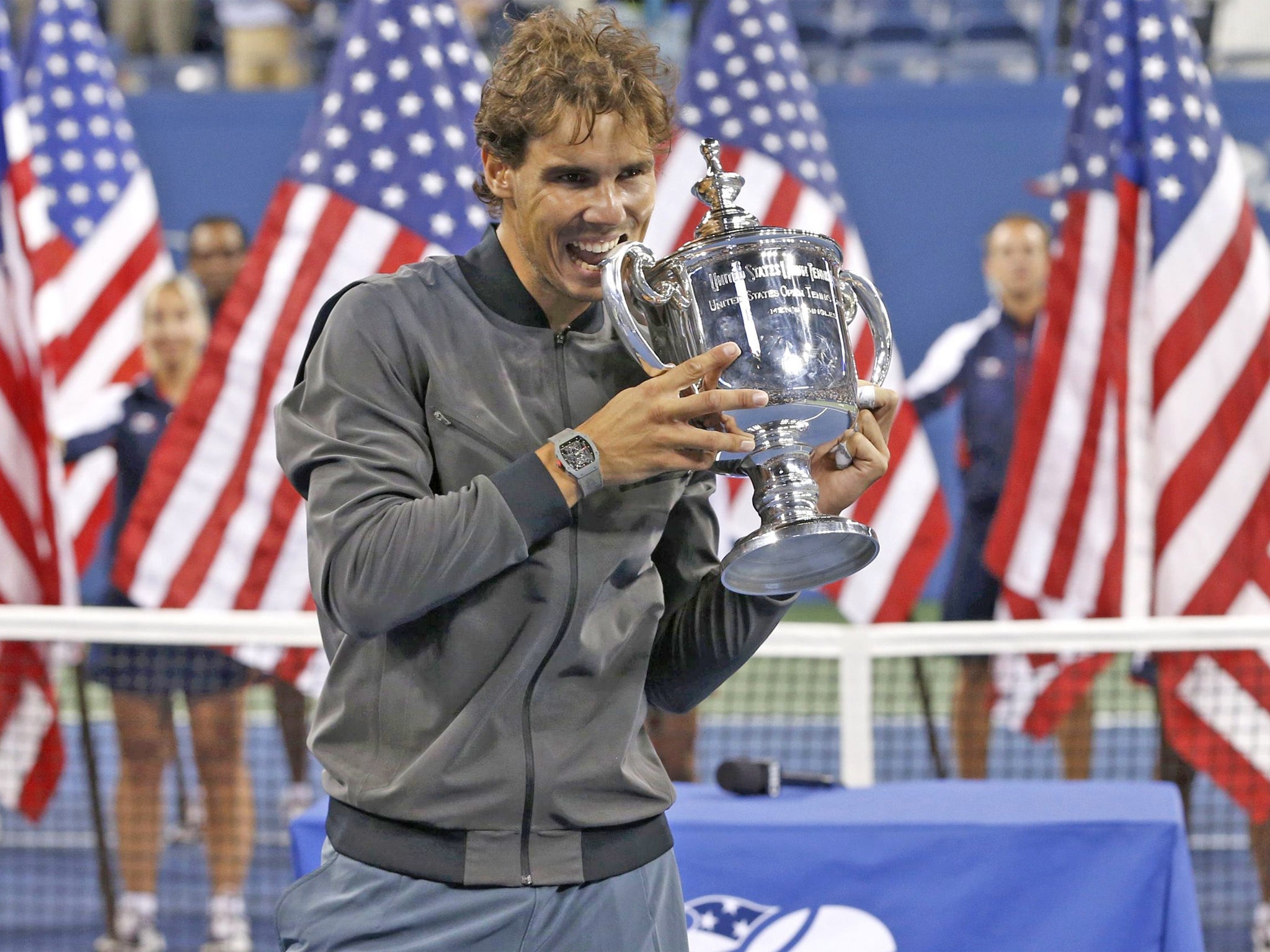 Rafa Nadal gets his hands - and his teeth - on the US Open trophy