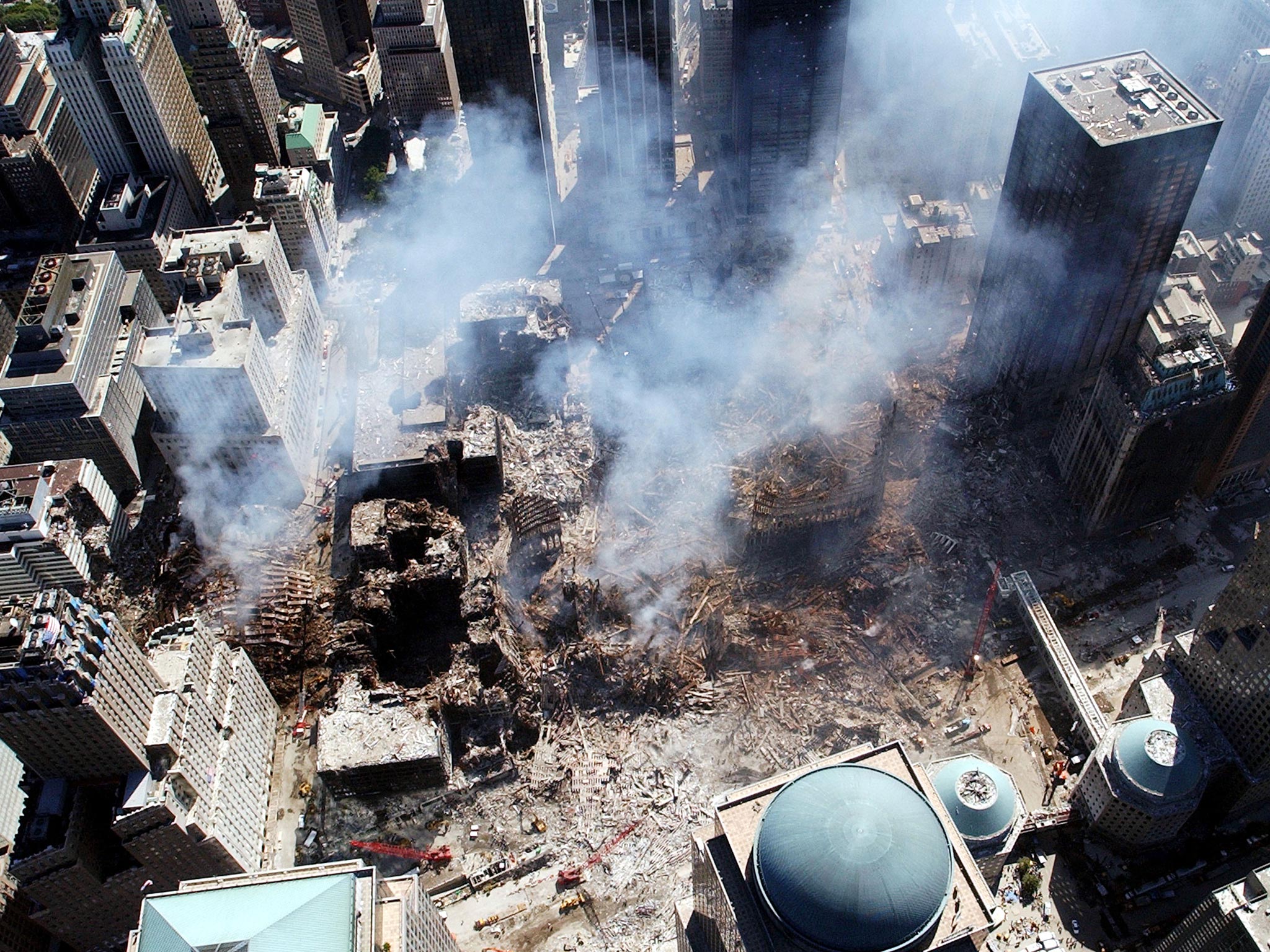 Toxic pollution filled the air while dangerous building materials piled up on the site of the towers