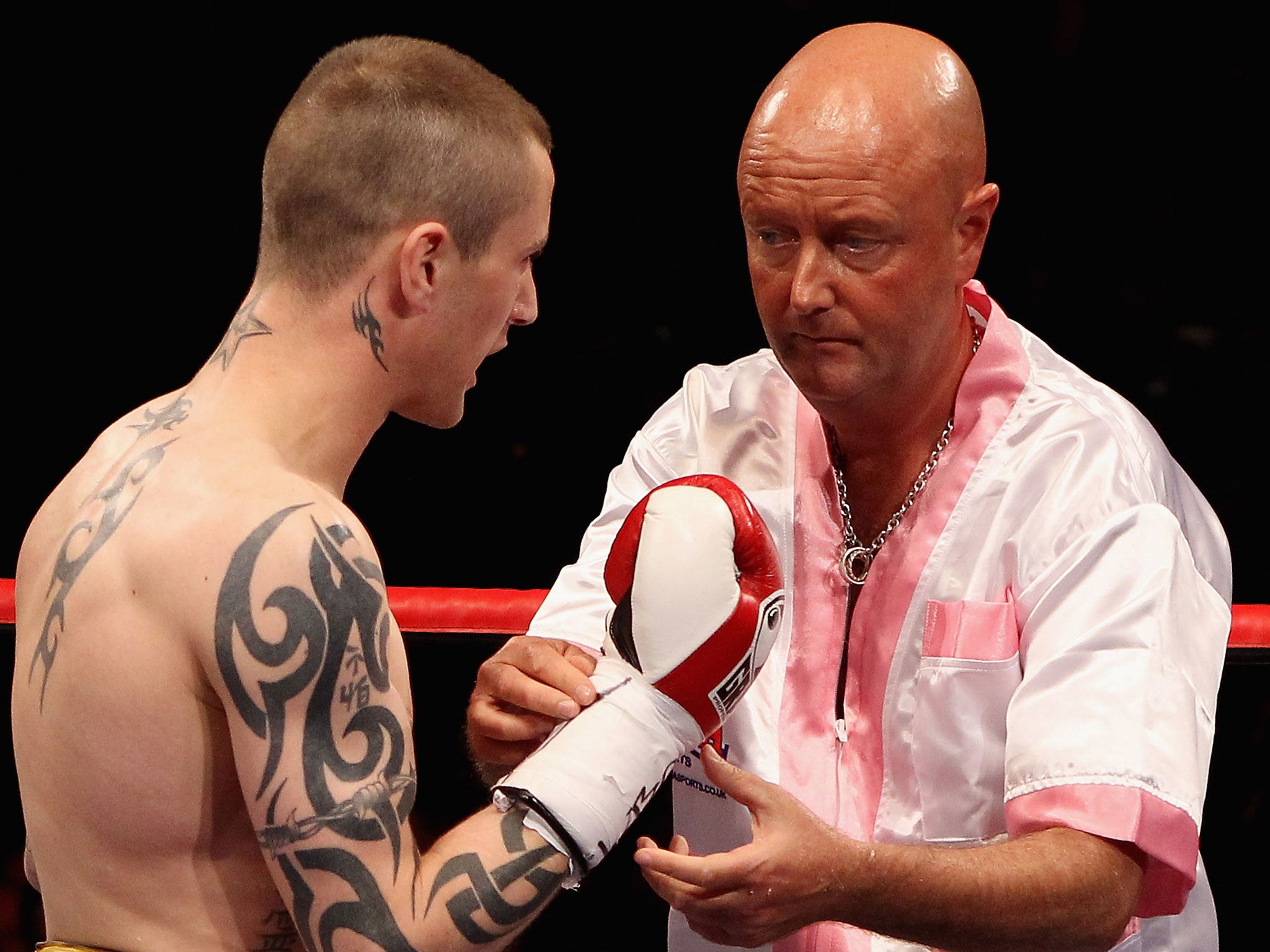 Dean Powell (right) working in the co rner for Ricky Burns during his win over Nicky Cook in July 2011